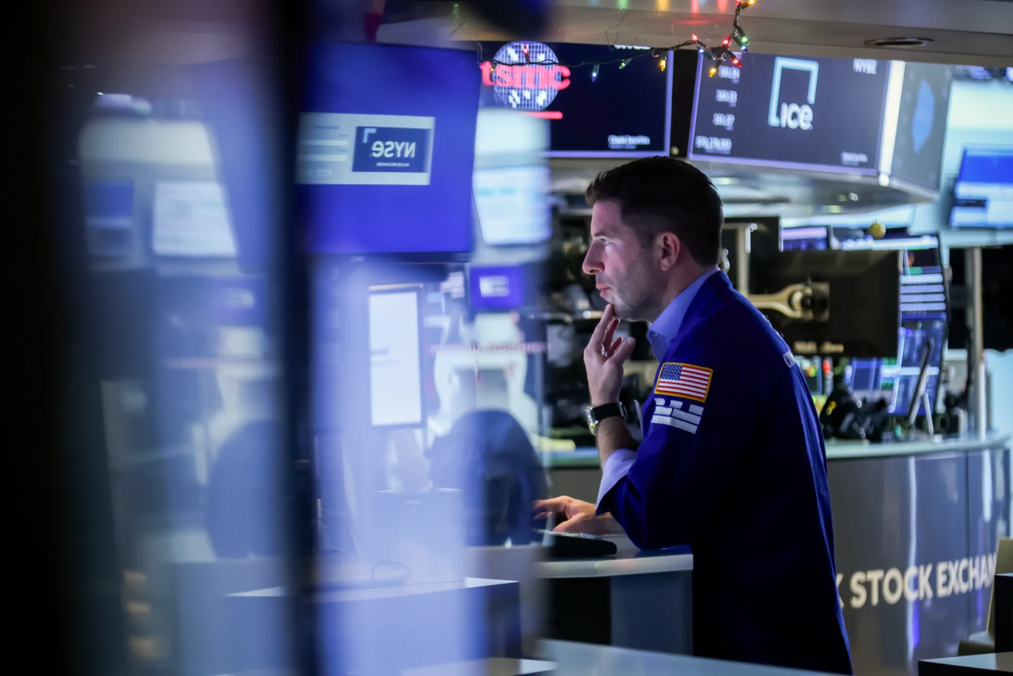 A trader works on the floor of the NYSE in New York on Jan. 2.