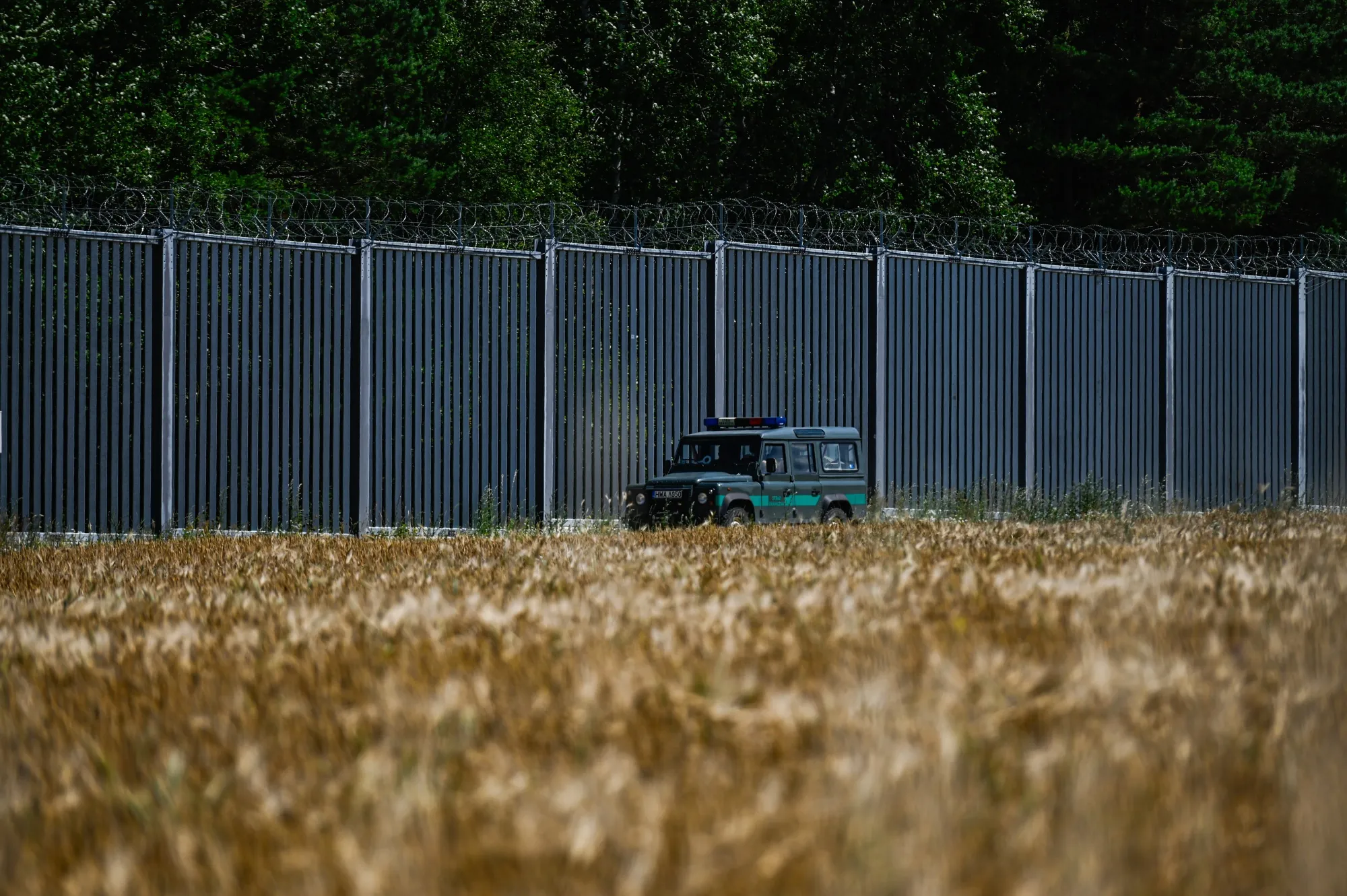 Polish border guards patrol&nbsp;the border wall between Poland and Belarus in Jurowlany, Poland.