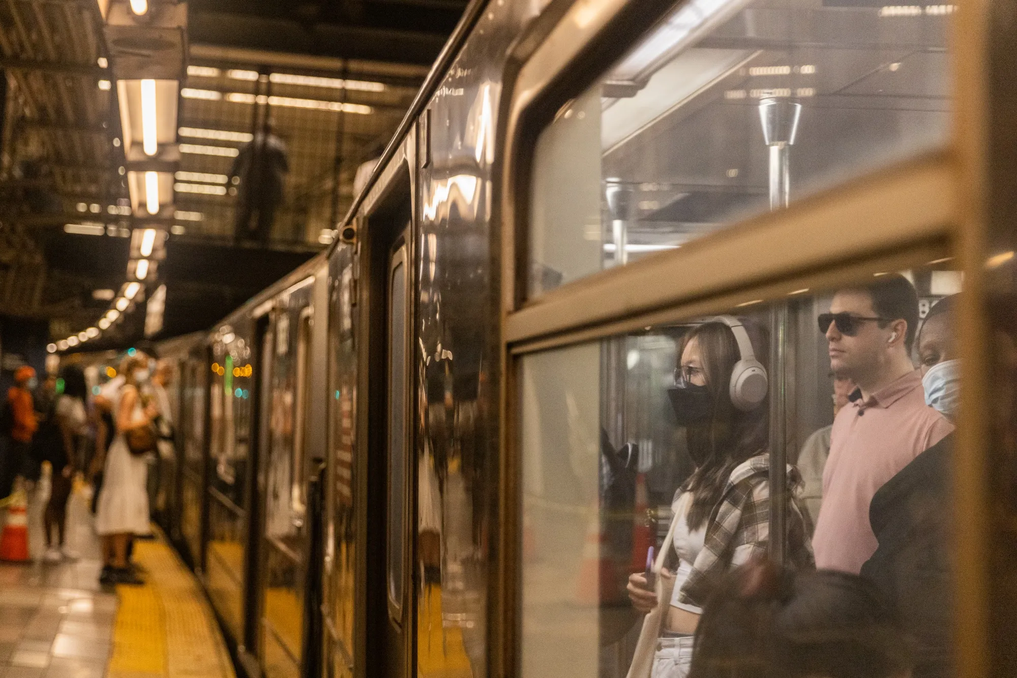 Commuters ride a subway in New York.