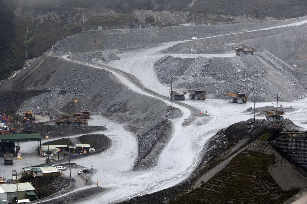 Haul trucks transport ore from the open pit at the Grasberg copper mine&nbsp;in Central Papua, Indonesia.