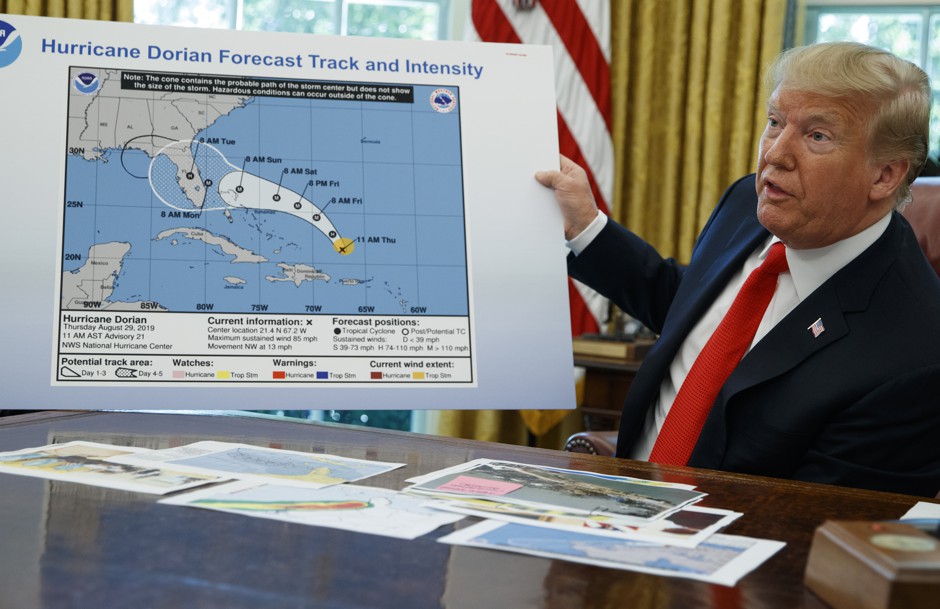 President Donald Trump shows off an altered map of Hurricane Dorian's anticipated track on September 4.