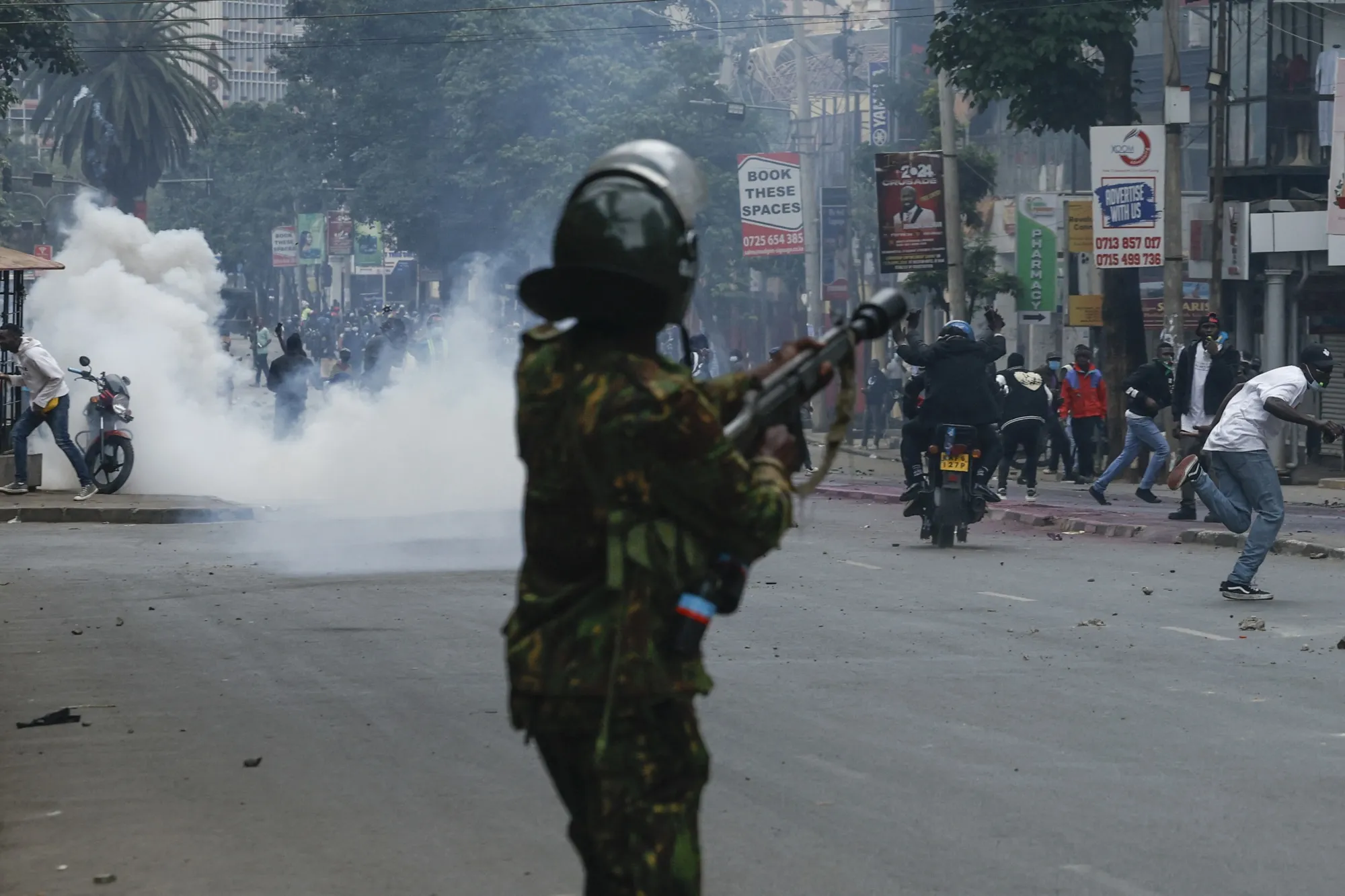 Kenyan riot police face anti-government protesters in Nairobi on July 16.
