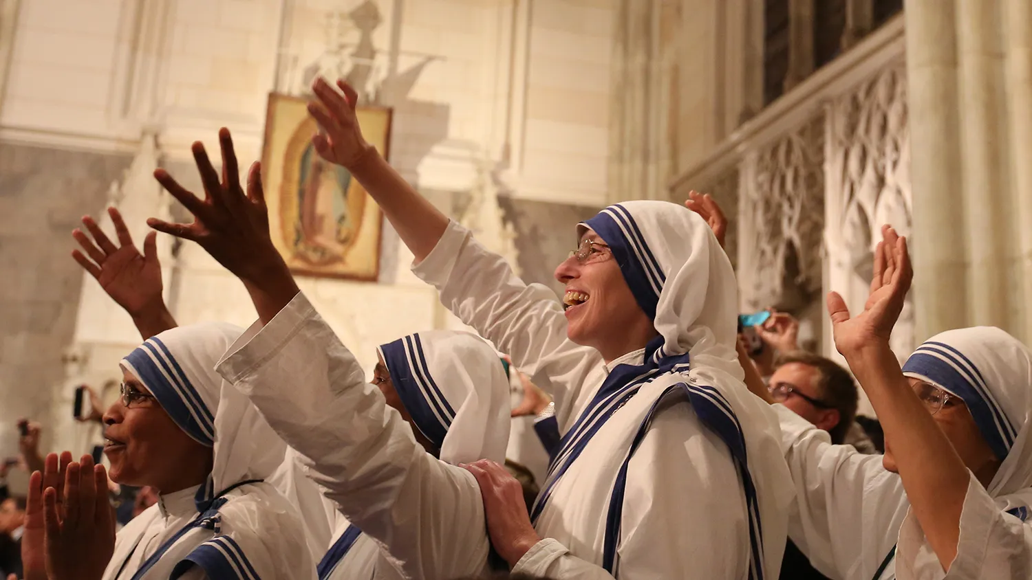 Nuns wave as Pope Francis arrives to lead a service at St. Patrick's Cathedral on Sept. 24, 2015, in New York City.

