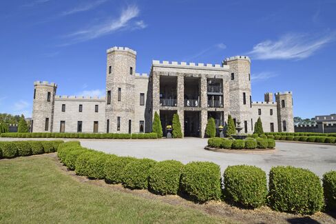 The 12,118-square-foot castle has 16 beds and 16 baths.