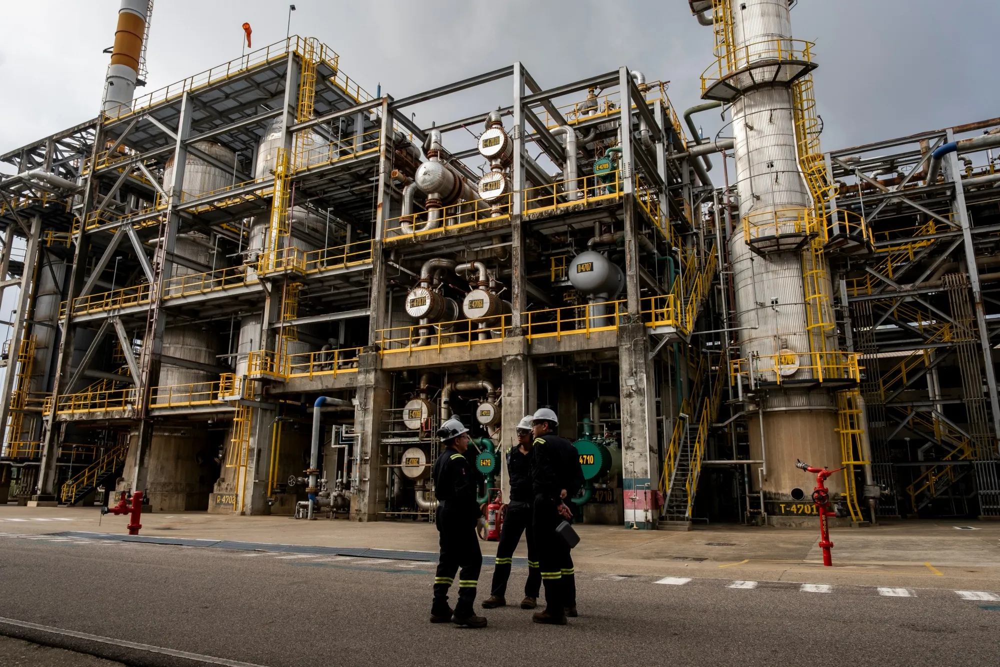 Workers inspect the fossil fuel processing plant at the Ecopetrol Barrancabermeja refinery in Barrancabermeja, Santander department, Colombia.