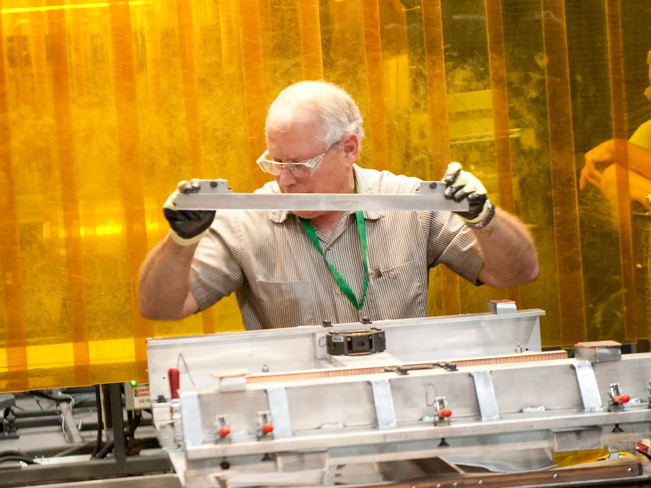 A worker prepares a nickel plate for a fuel cell .
