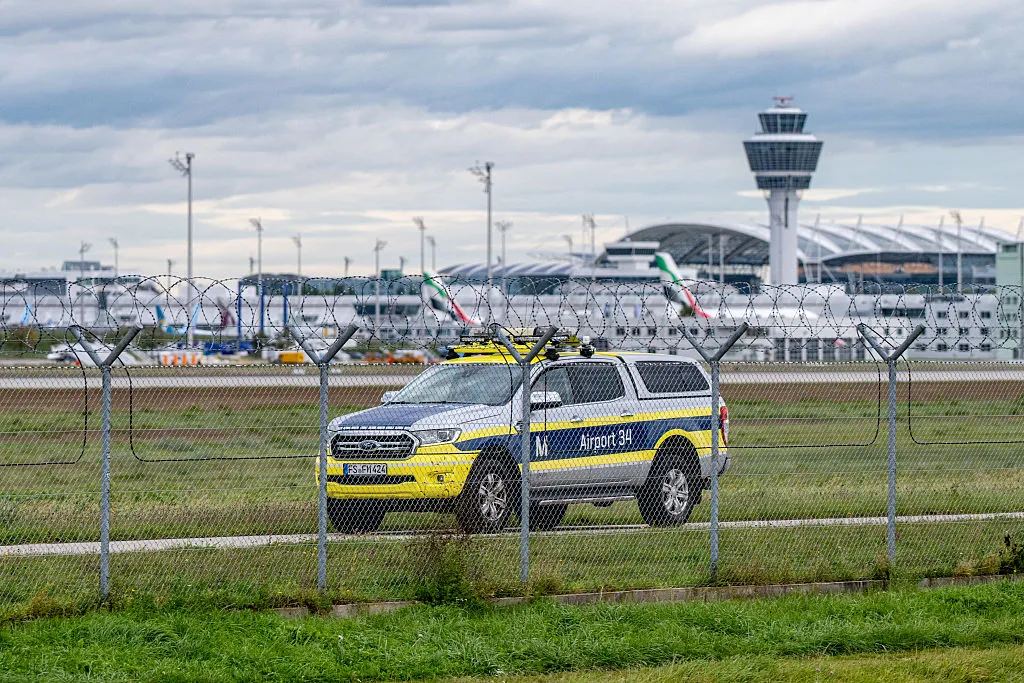 An airport vehicle patrols the grounds of Munich Airport. after drone sightings this month.
