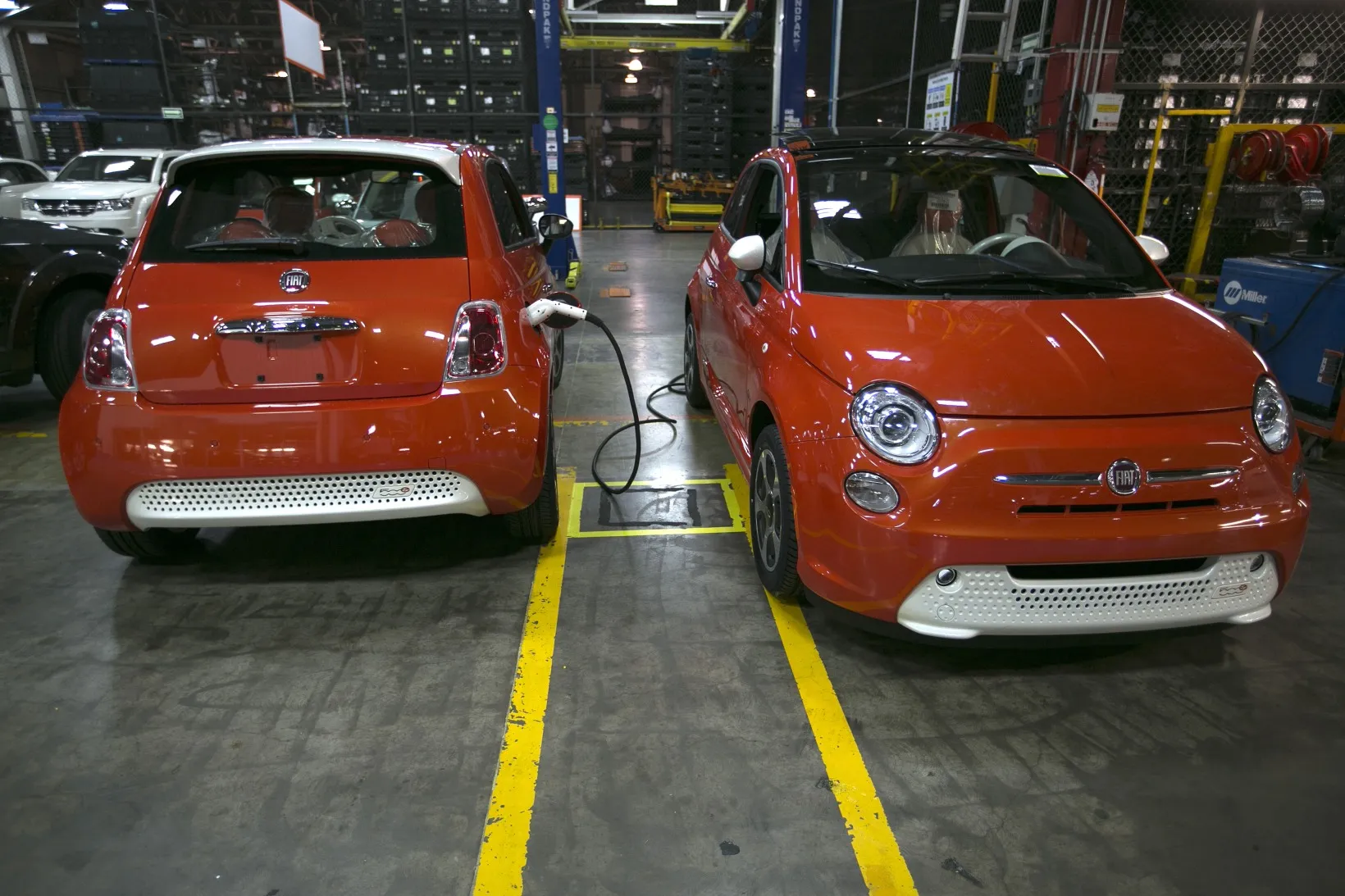 Fiat 500 electric cars are charged at the assembly plant in Toluca, Mexico.