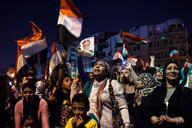 Egyptian supporters of the military’s removal of President Mohamed Mursi celebrate outside the presidential palace on July 19 in Cairo