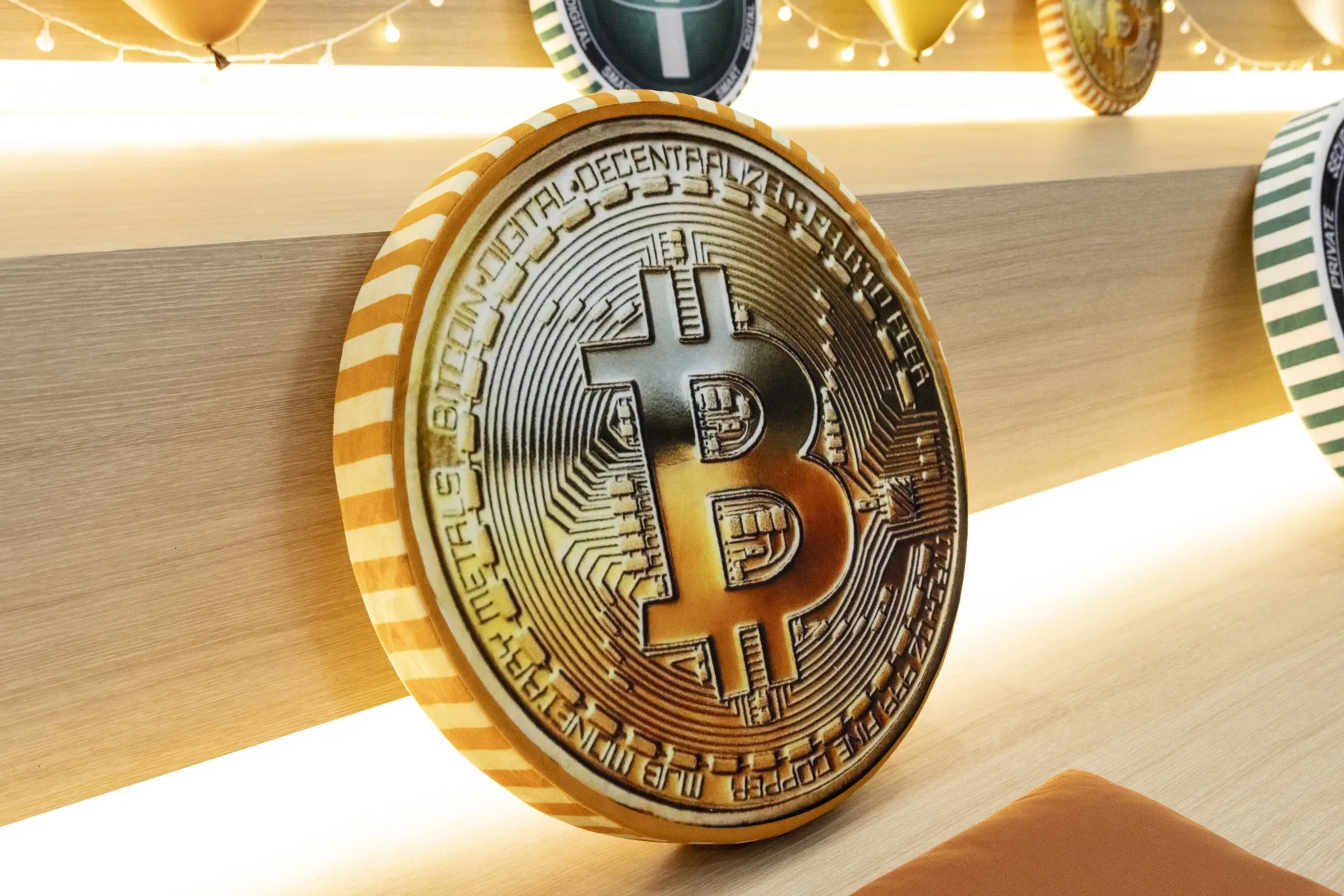 The Bitcoin logo on a cushion displayed at a Bithumb exchange office in Seoul, South Korea.