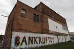 Street art on a building in Detroit reflects the city's ongoing financial crisis. 