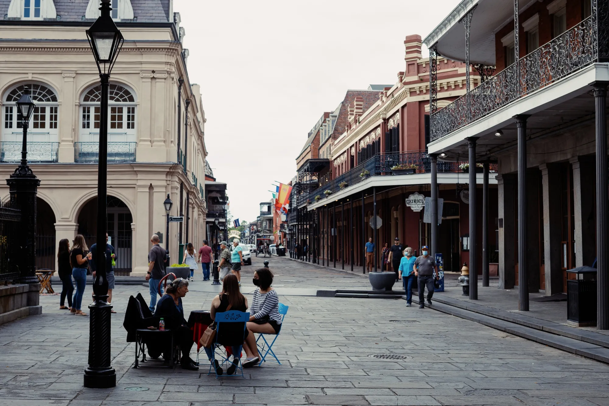 Pedestrians walk through the the French Quarter neighborhood of New Orleans, Louisiana, U.S.
