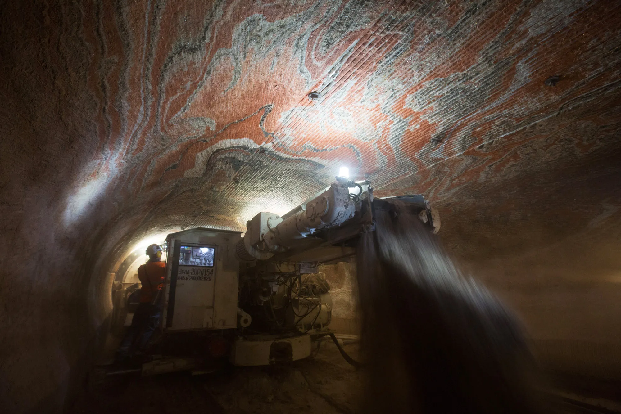 Workers operate a drilling machine during excavations for sylvinite mineral ore, used to produce potash fertilizer, in an&nbsp;underground potash mine&nbsp;in the Perm region of&nbsp;Russia.&nbsp;