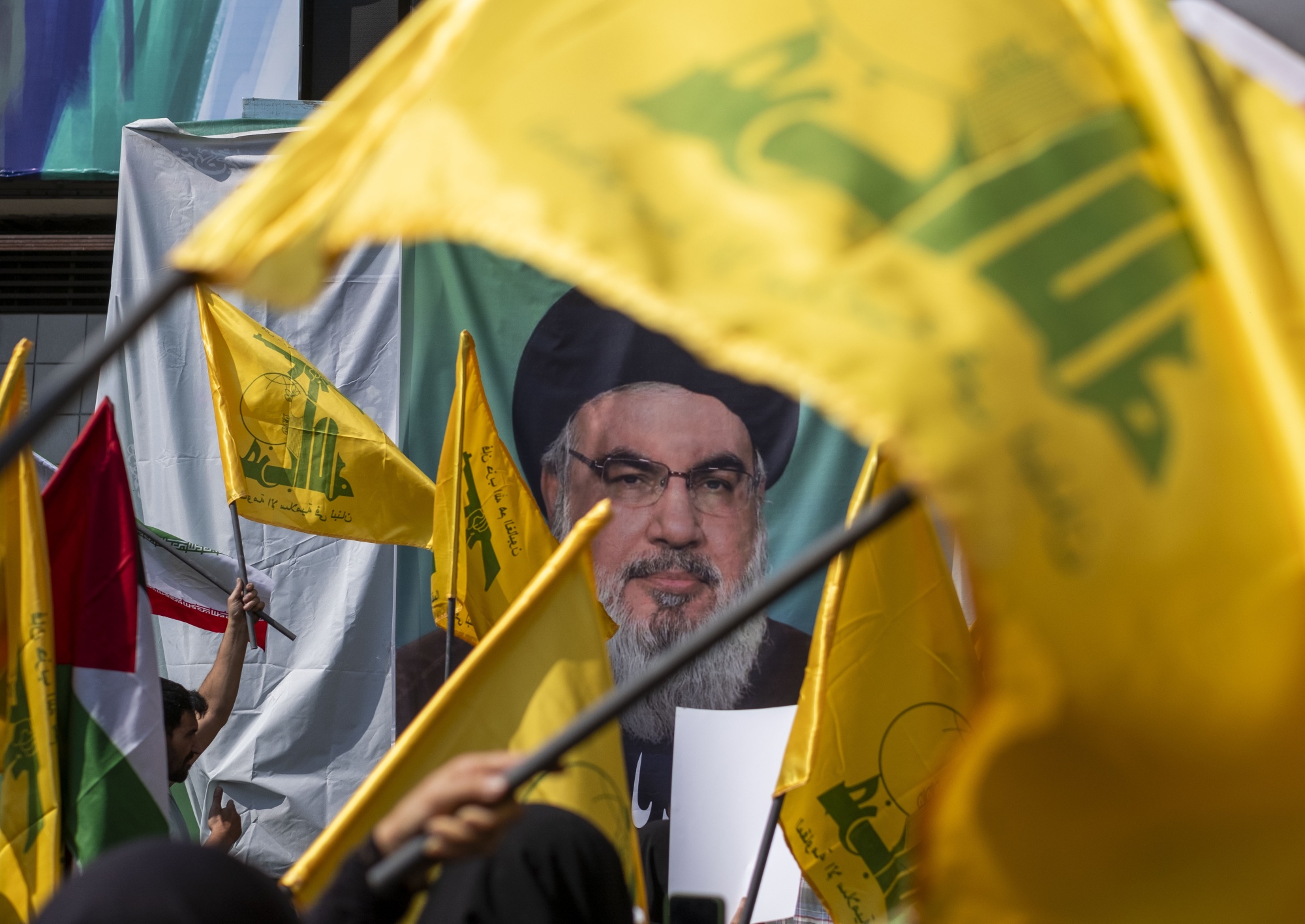A portrait of Hassan Nasrallah.