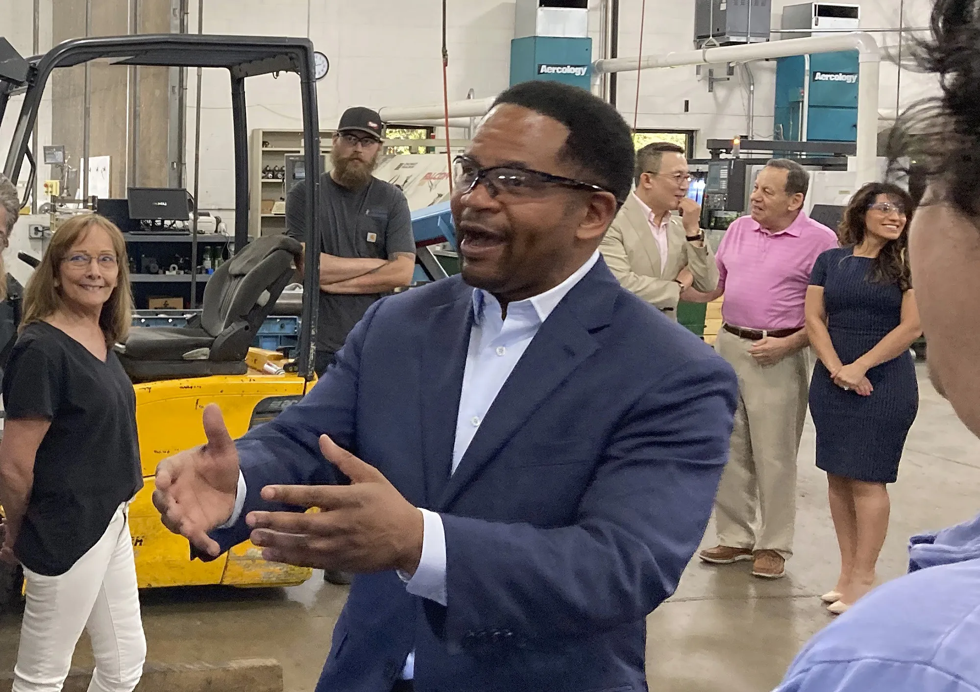 Richard Irvin speaks with employees during a factory tour&nbsp;in Wauconda, Illinois, on June 21.
