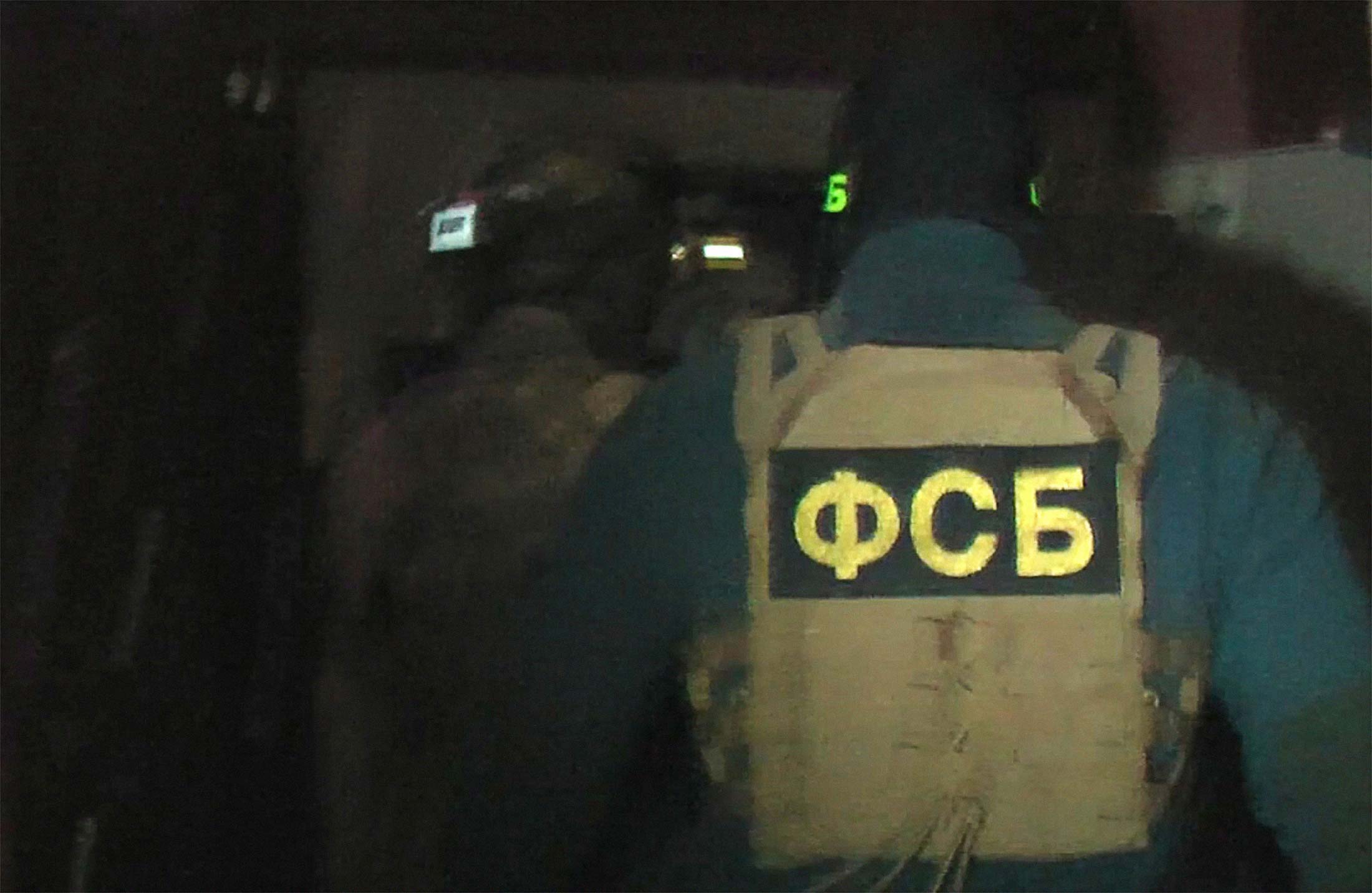 A video still of the Russian Federal Security Service during a raid in December 2018.