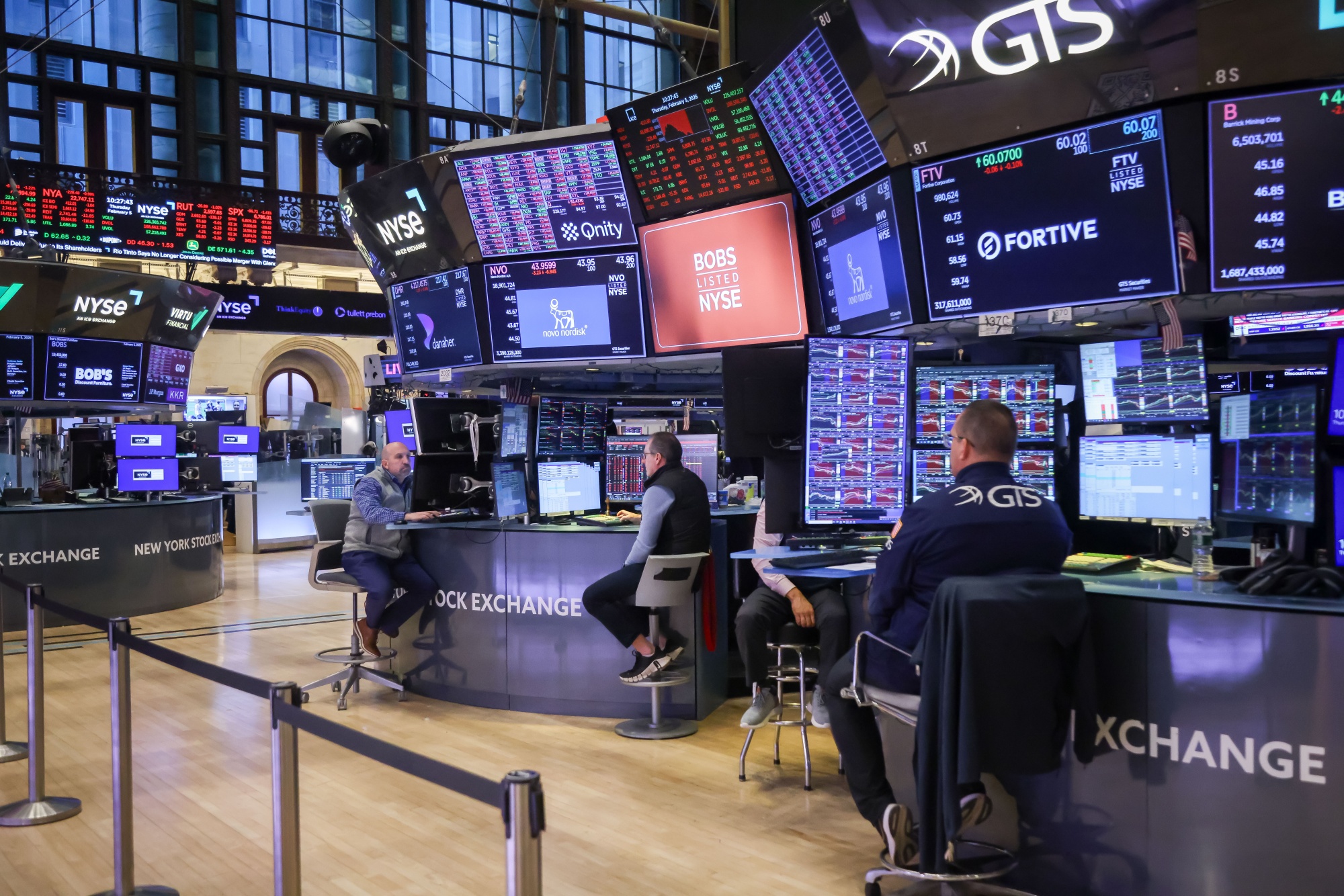 Traders work on the floor of the New York Stock Exchange.