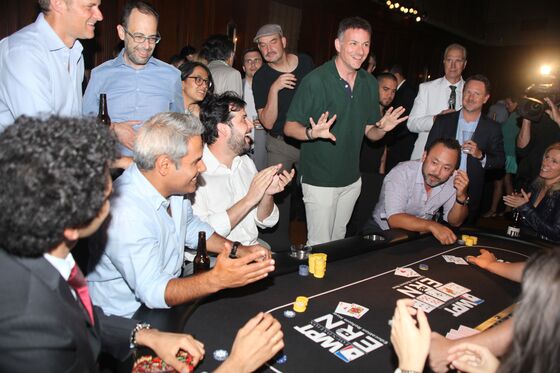 Derivatives Trader Hits a Full House for Charity Poker Crown