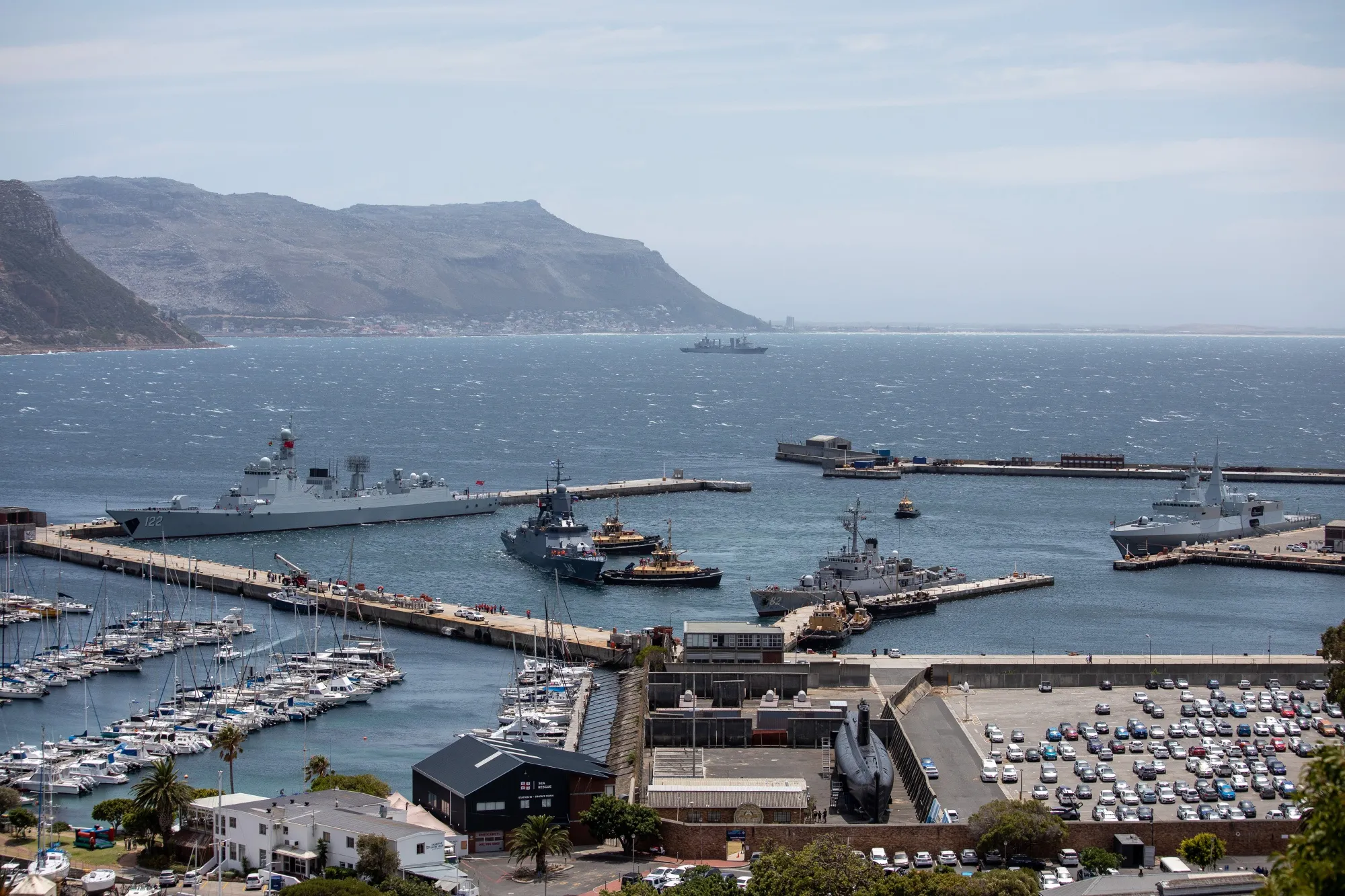 The Chinese navy destroyer CNS Tangshan (122), top left, Russian navy corvette Stoikiy (545), center, and Iranian navy corvette IRIS Naghdi (82), right, ahead of naval exercises at Simon's Town harbor in Cape Town.