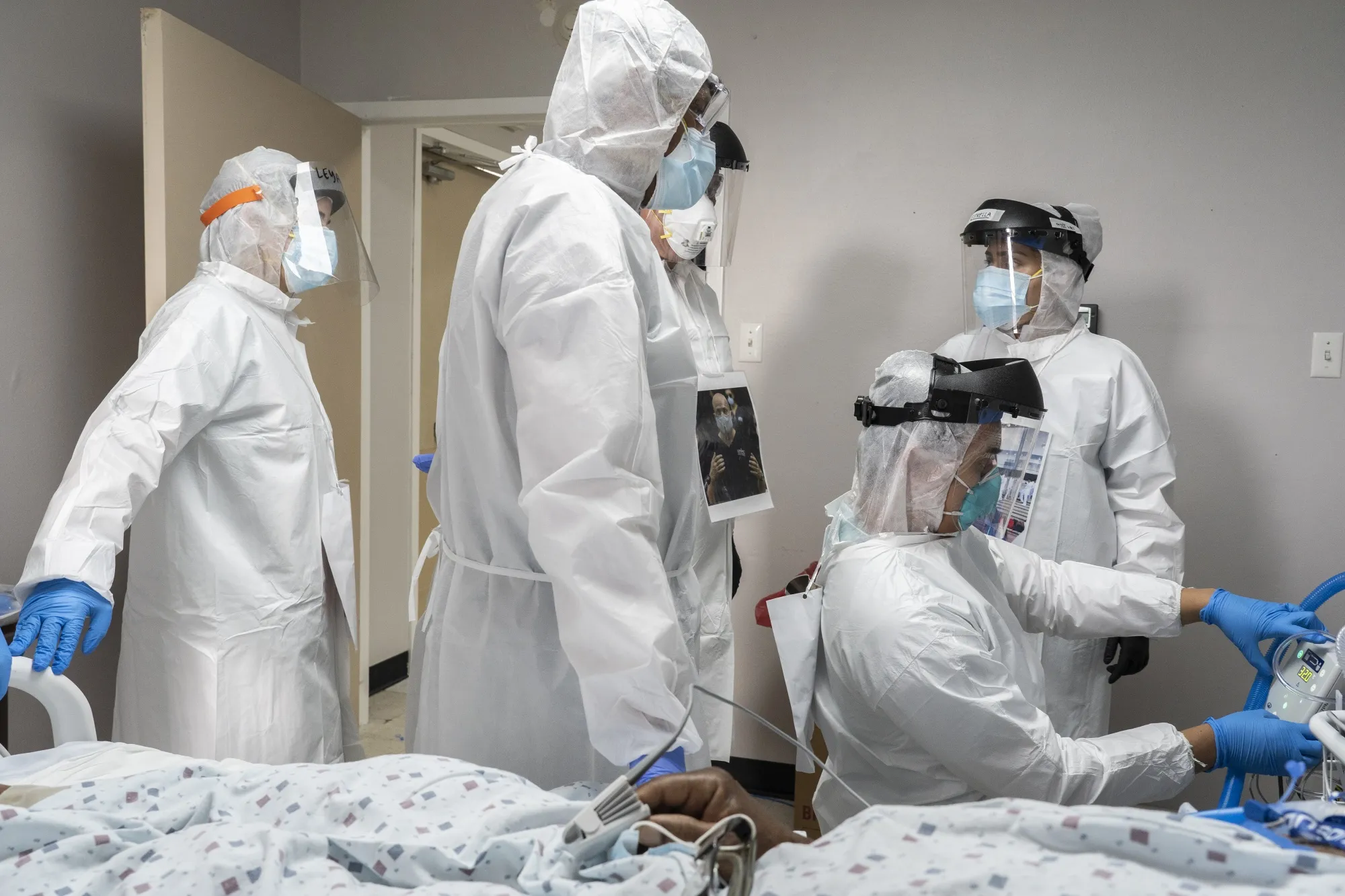 Doctors and nurses wearing protective gear treat a patient in the Covid-19 intensive care unit (ICU) at the United Memorial Medical Center (UMMC) in Houston, Texas, on&nbsp;June 29.