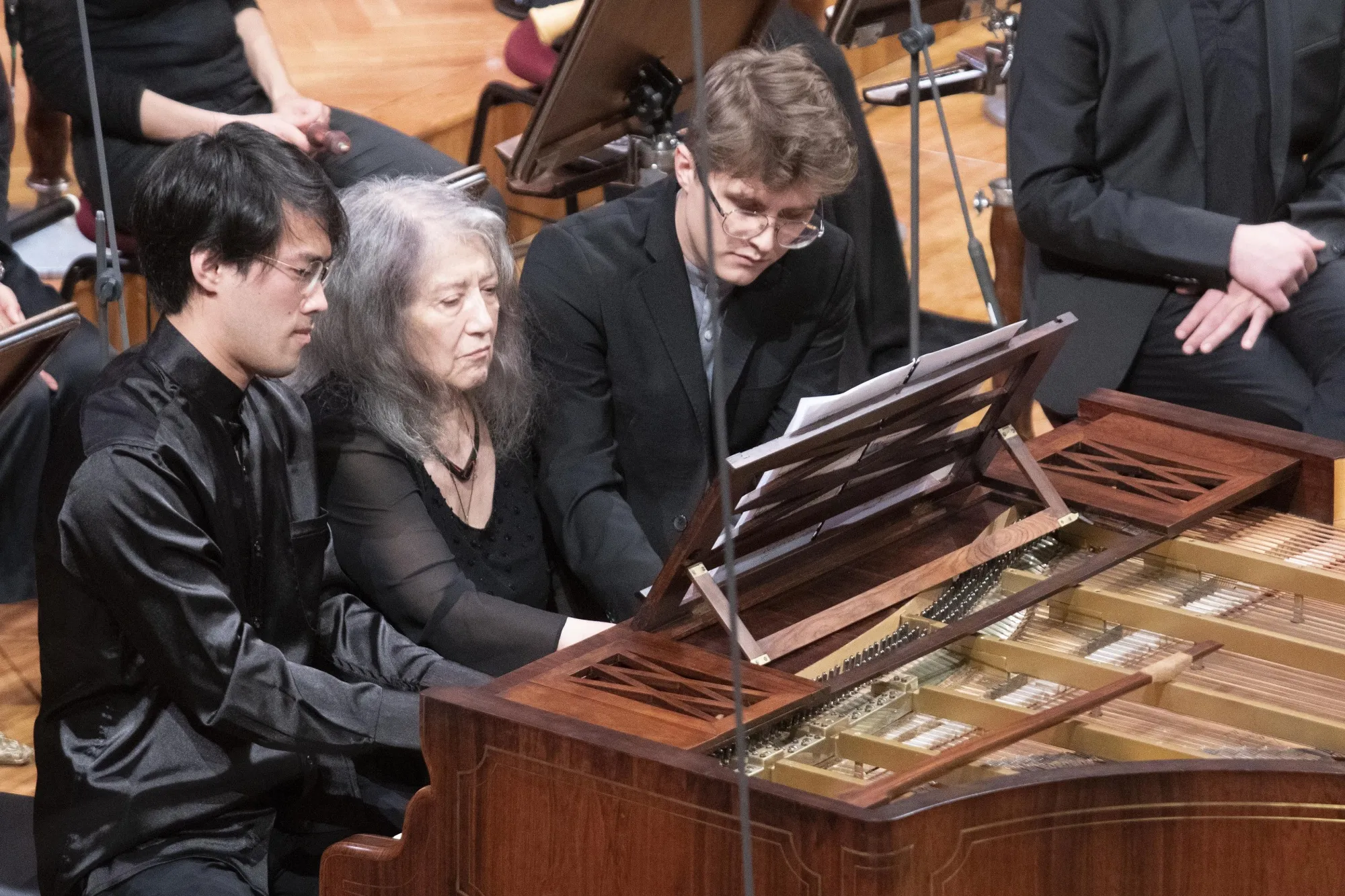 Martha Argerich, centre, Poland's Tomasz Ritter, right, and Canadian Bruce Liu, left, play a six-hands encore during a gala concert opening the 2nd Chopin Competition on Period Instruments at the National Philharmonic in Warsaw, Poland, on Thursday, Oct. 5, 2023. (AP Photo)