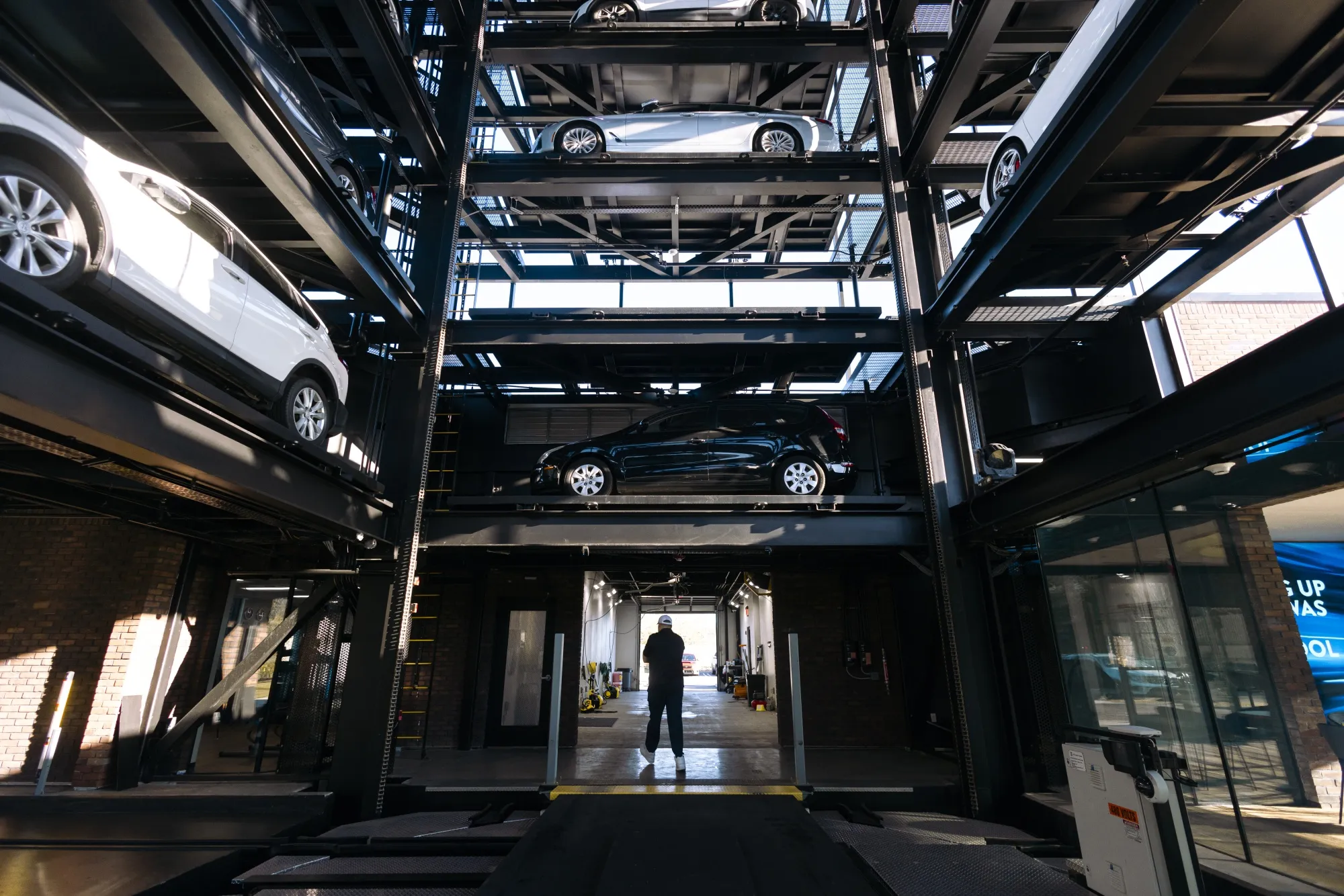 A worker inside a Carvana vending machine in Uniondale, New York.