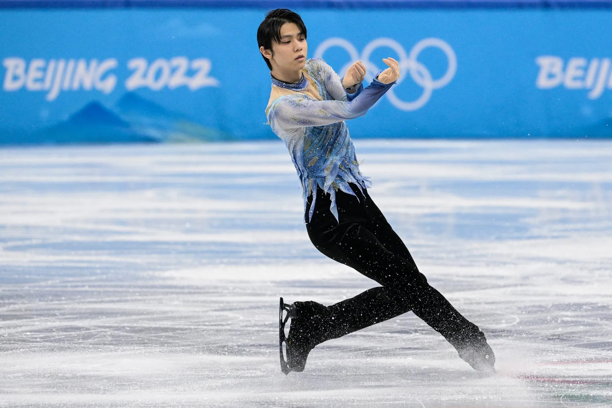 Yuzuru Hanyu competes in the men's single skating at the figure skating event during the Beijing 2022 Winter Olympic Games in China, on Feb. 8.