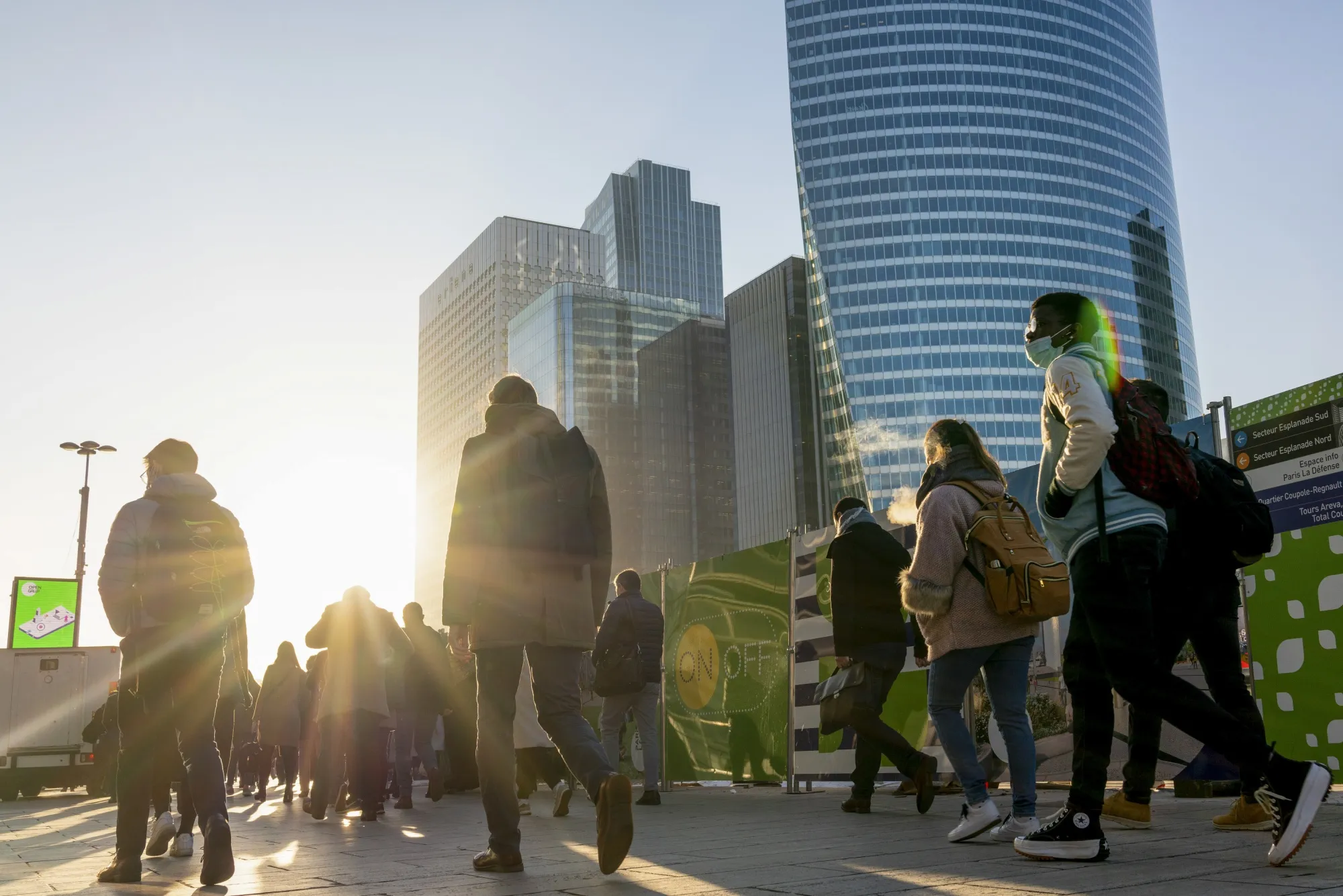 Commuters in the La Defense financial district of Paris, France.