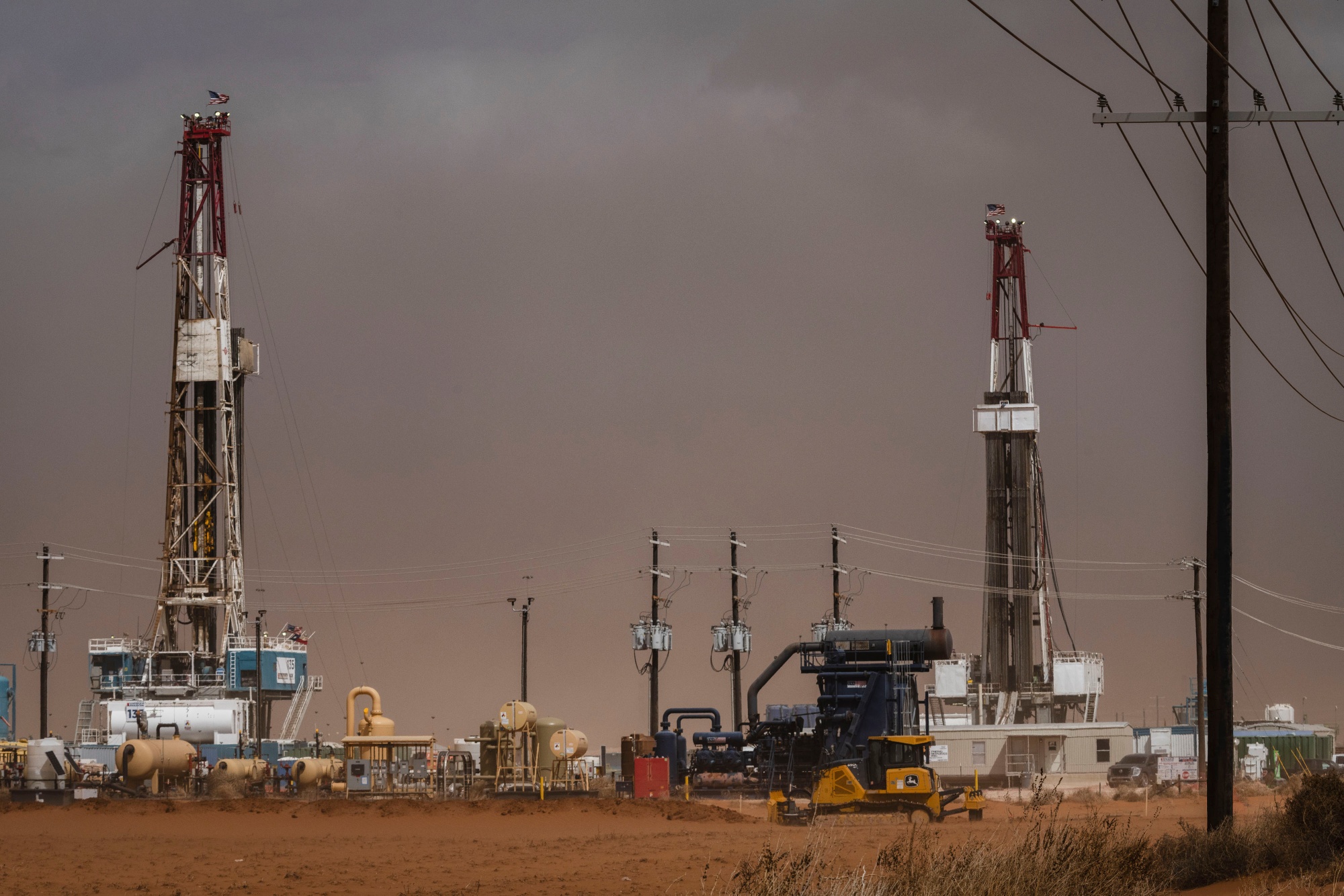 Oil drilling rigs on the Permian Basin shale patch near Stanton, Texas.
