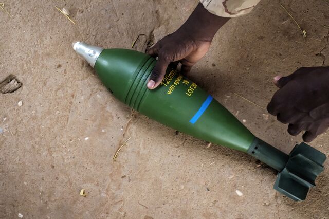 A member of the Sudanese Armed Forces with a captured projectile, intended to be used in an Unmaned Aerial Vehicle (UAV), in the city of Omdurman, Sudan, on June 18.