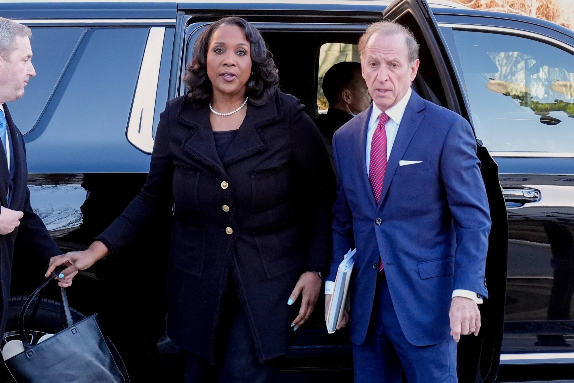 Federal Reserve governor Lisa Cook and attorney Abbe Lowell arrive at the Supreme Court in Washington on Jan. 21.