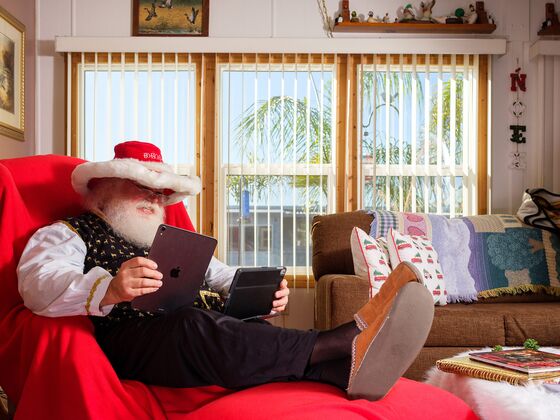 It’s Masks and Plexiglass for Mall Santas Trying to Lure Family Shoppers