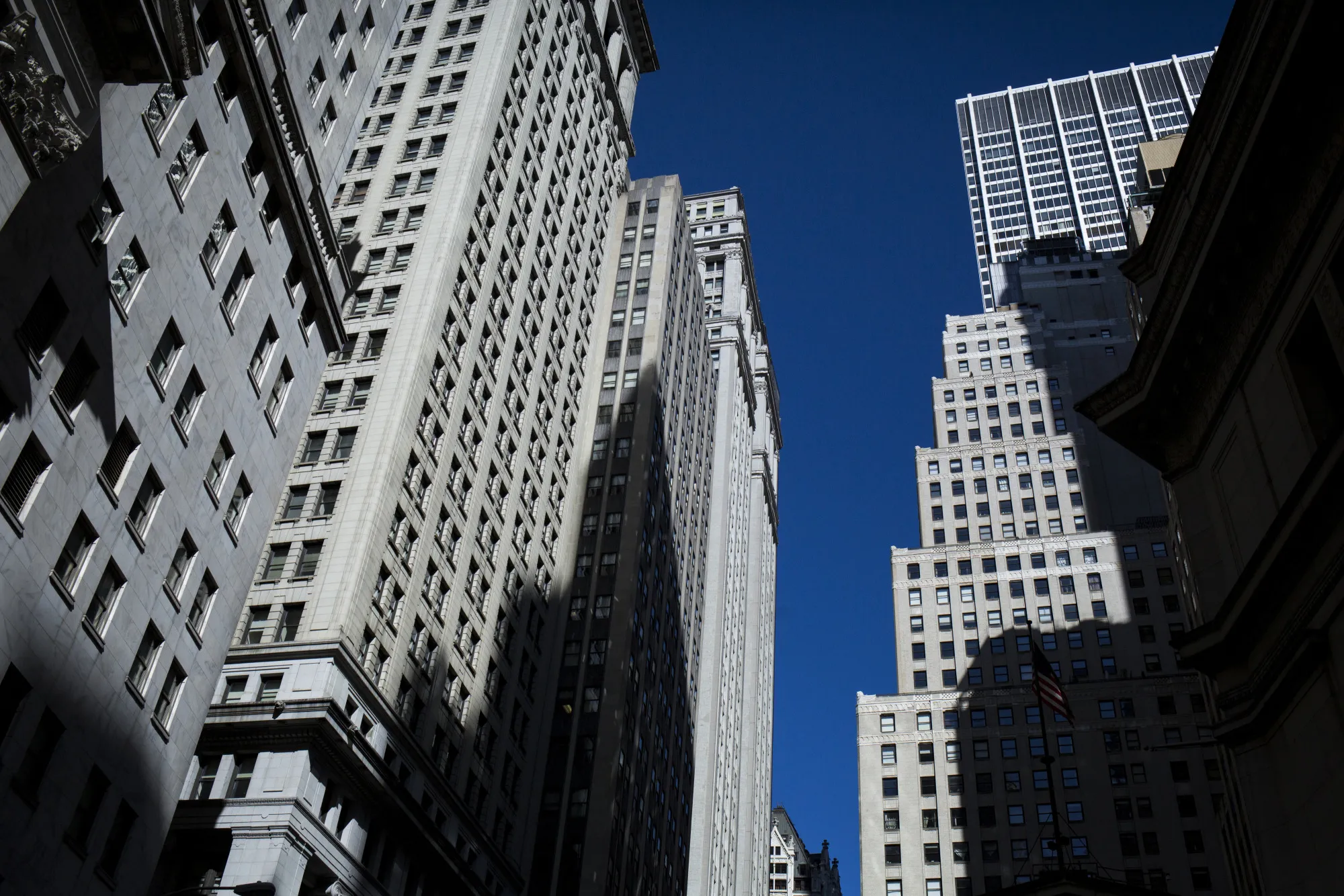 Buildings stand on Wall Street near the New York Stock Exchange (NYSE) in New York, U.S.