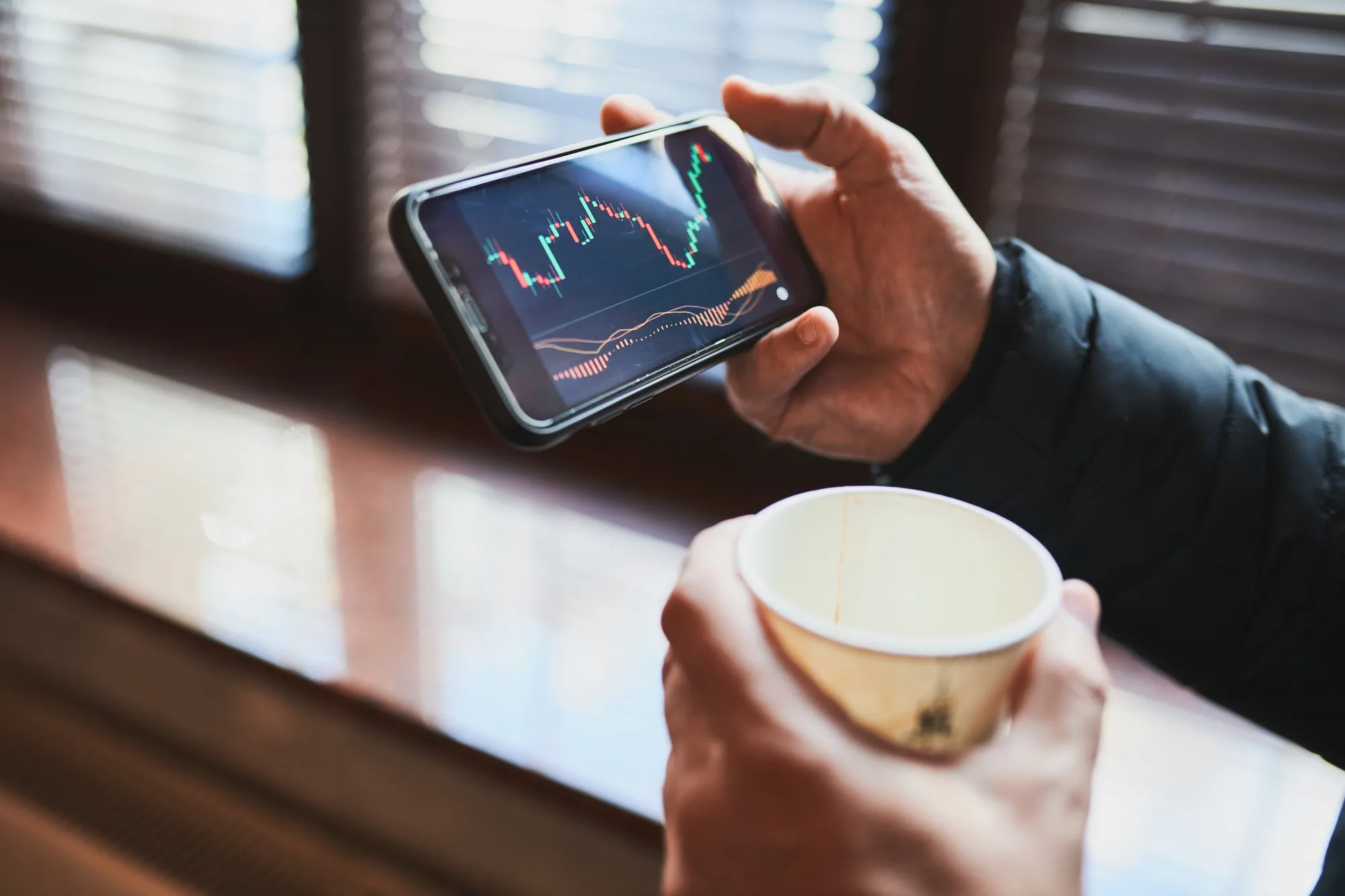 Person Investing Trading On Stock Cryptocurrency Market Using Investing Application On Smartphone
