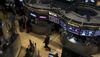 Traders are seen working on the floor of the New York Stock Exchange.