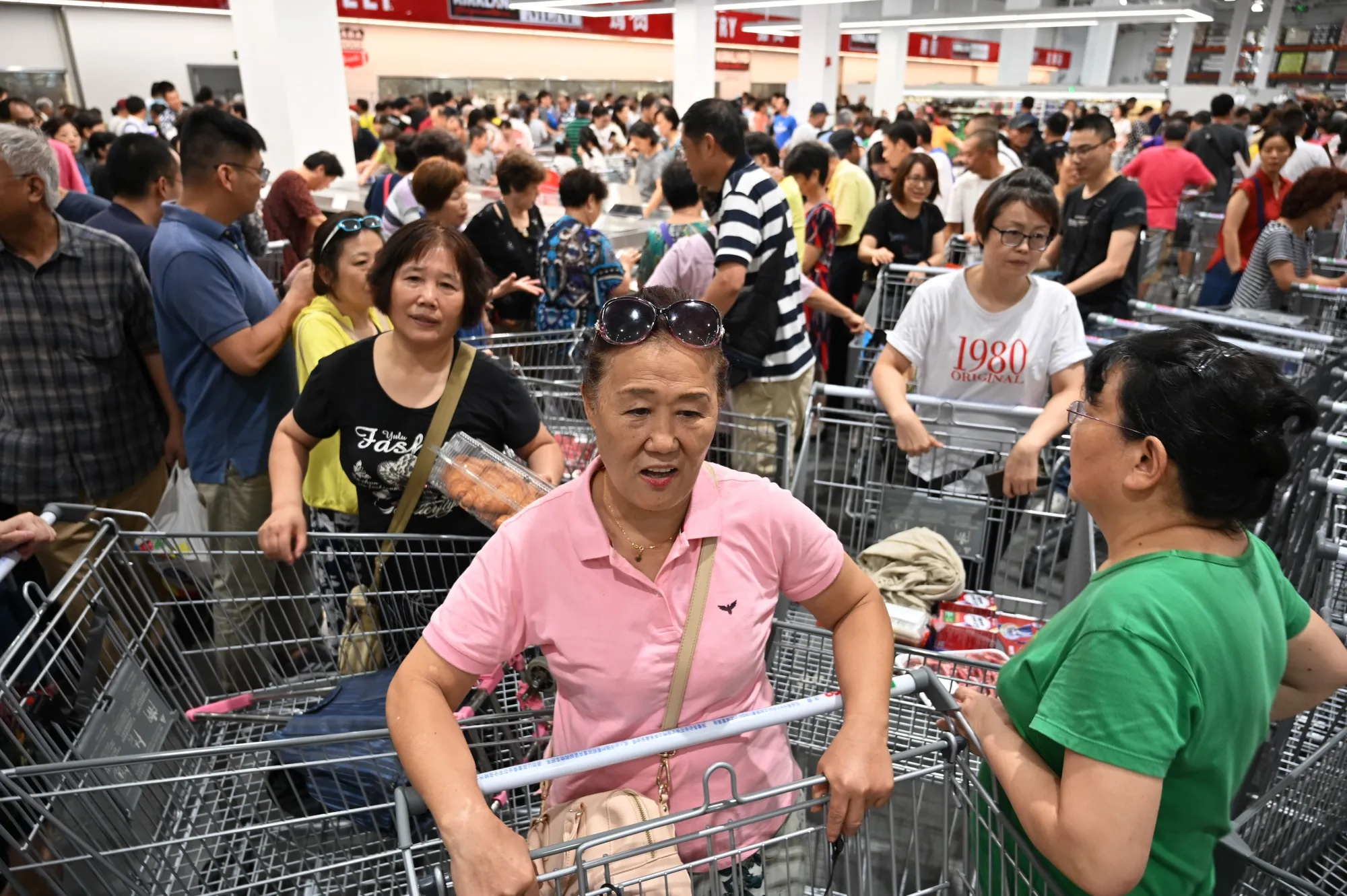 People visit the first Costco outlet in China, in Shanghai on Aug. 27.