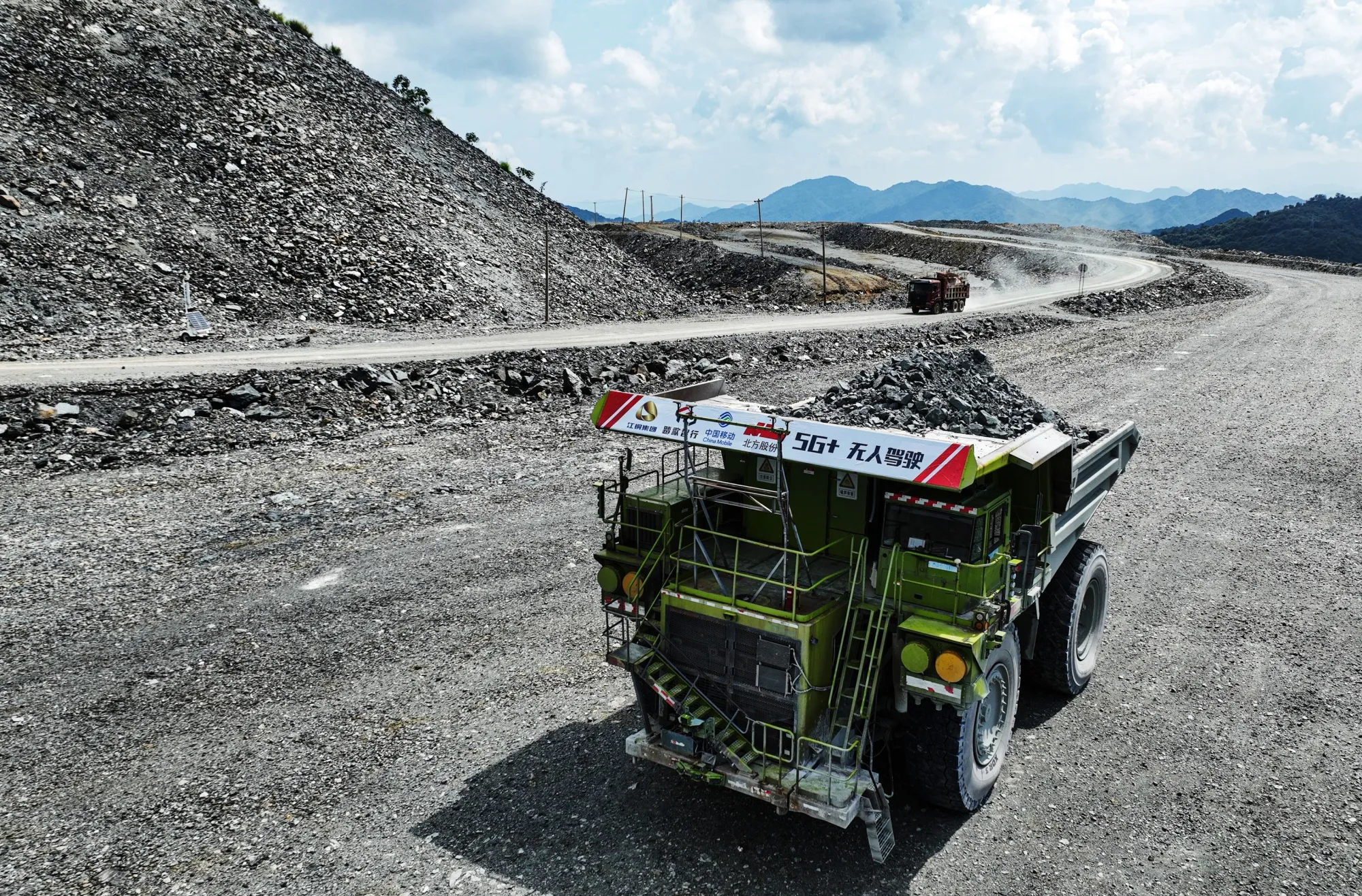 An unmanned mining vehicle supported by 5G technology works at a mine field of Jiangxi Copper.