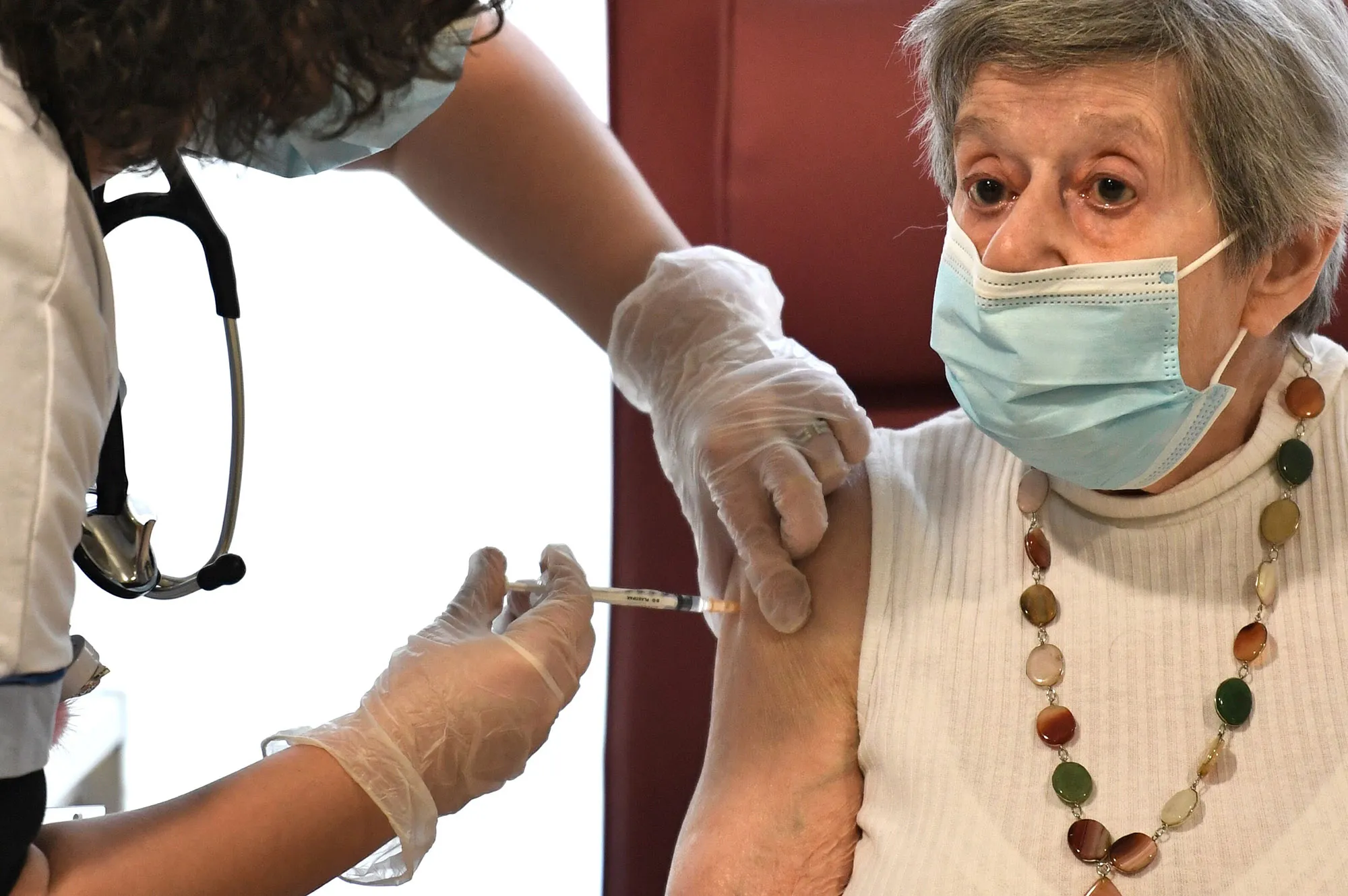 A nurse administers the Pfizer-BioNTech&nbsp;vaccine at a care home in the suburbs of Paris.