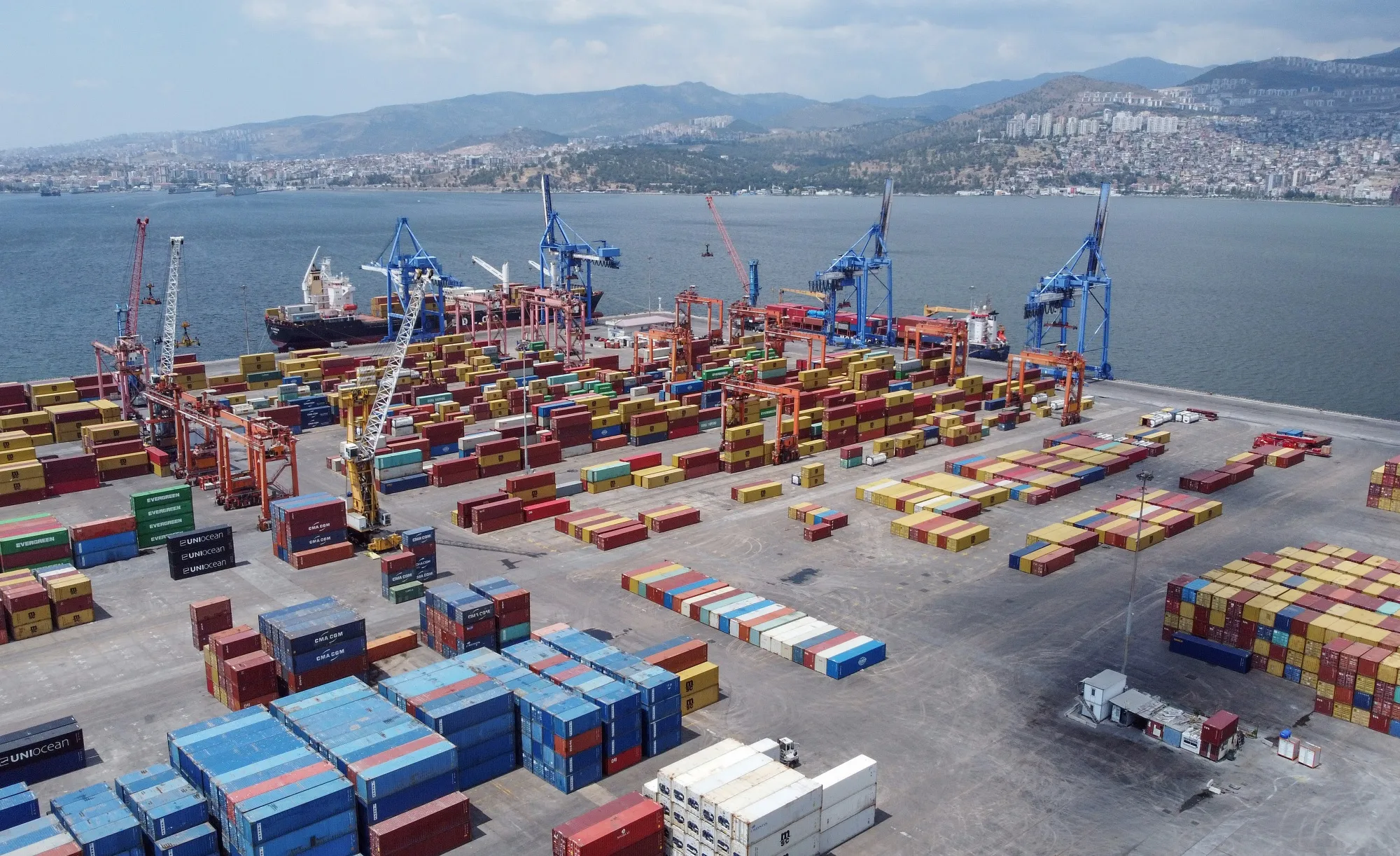 Ship-to-shore cranes and shipping containers at Alsancak Port in Izmir, Turkey.