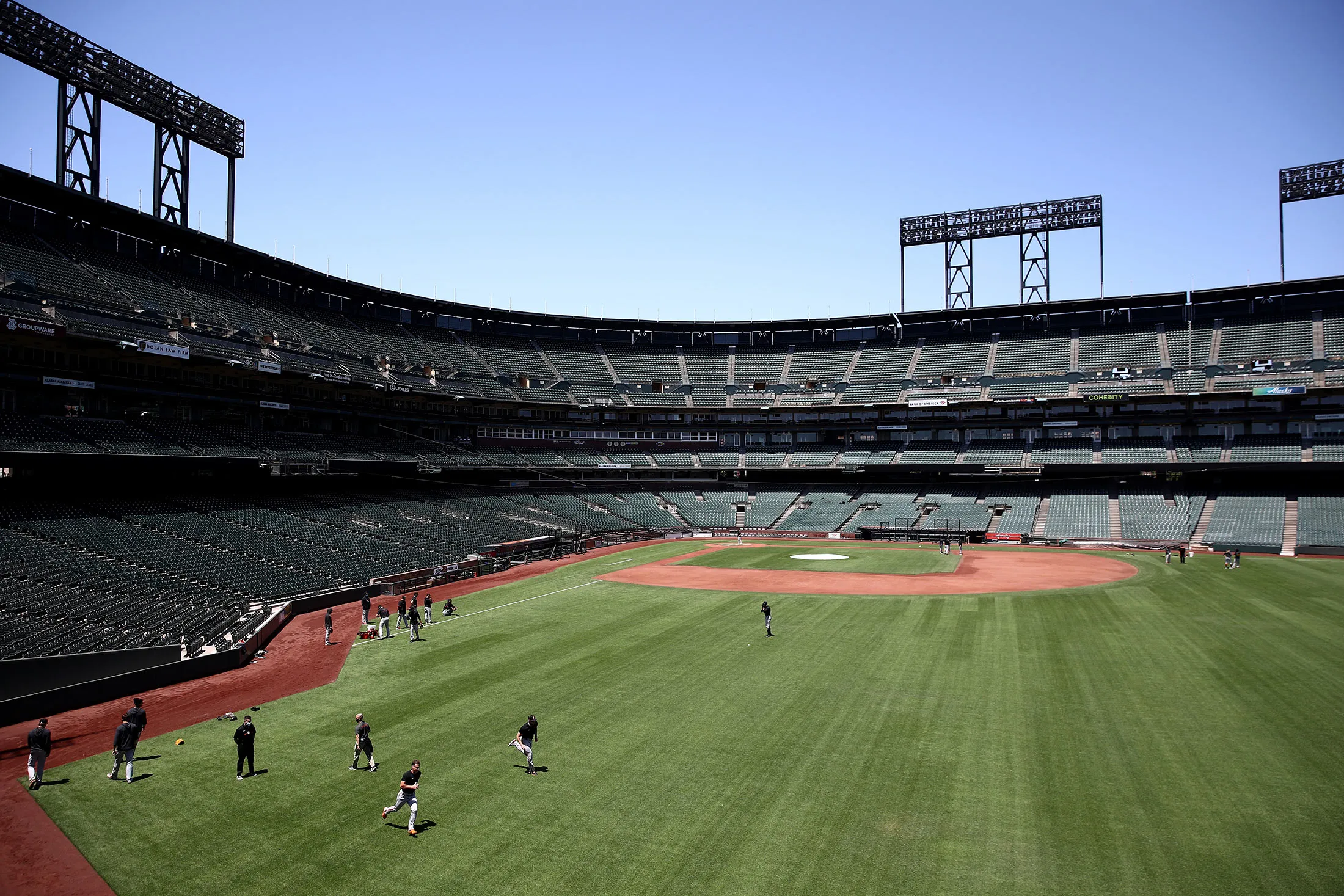 Players on the San Francisco Giants work out in the outfield during summer workouts at Oracle Park&nbsp;on July 3.