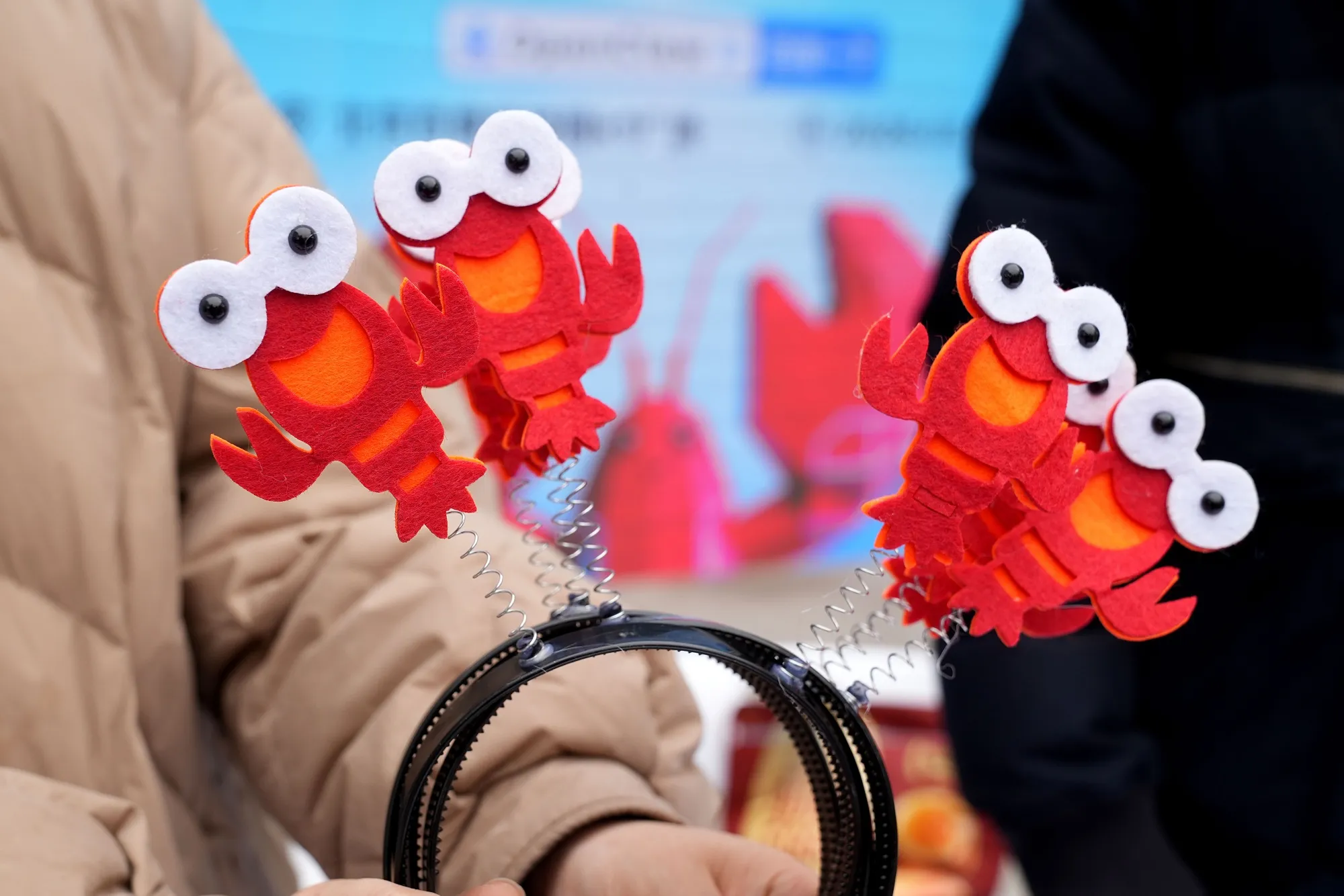 Lobster-themed headbands at Baidu Inc.'s OpenClaw Lobster Market event in Beijing on March 17.