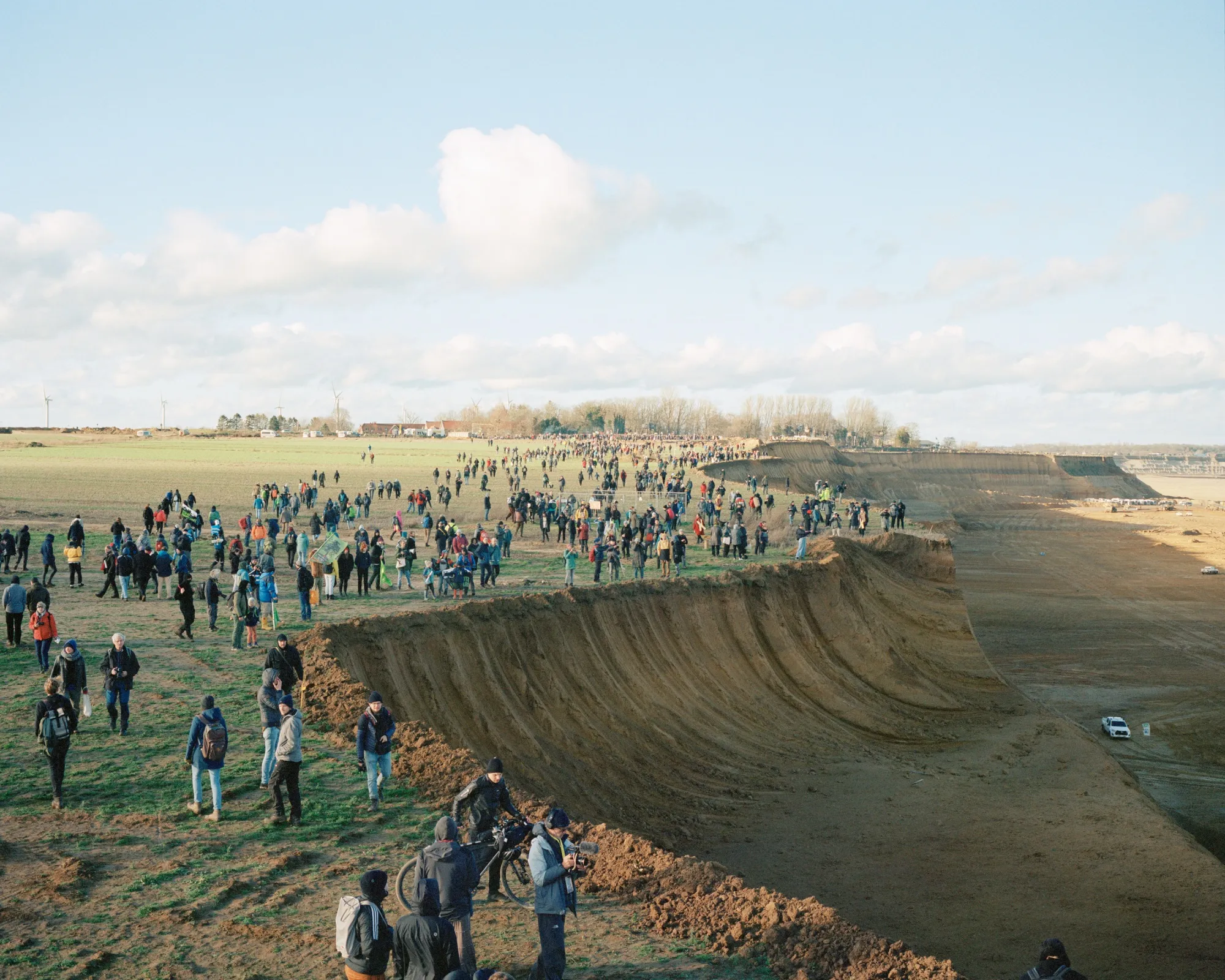 Demonstrators walk along the advancing edge of the Garzweiler II open-pit mine near Luetzerath on the last weekend they could legally enter the village. Luetzerath, Germany, on Jan. 8, 2023.