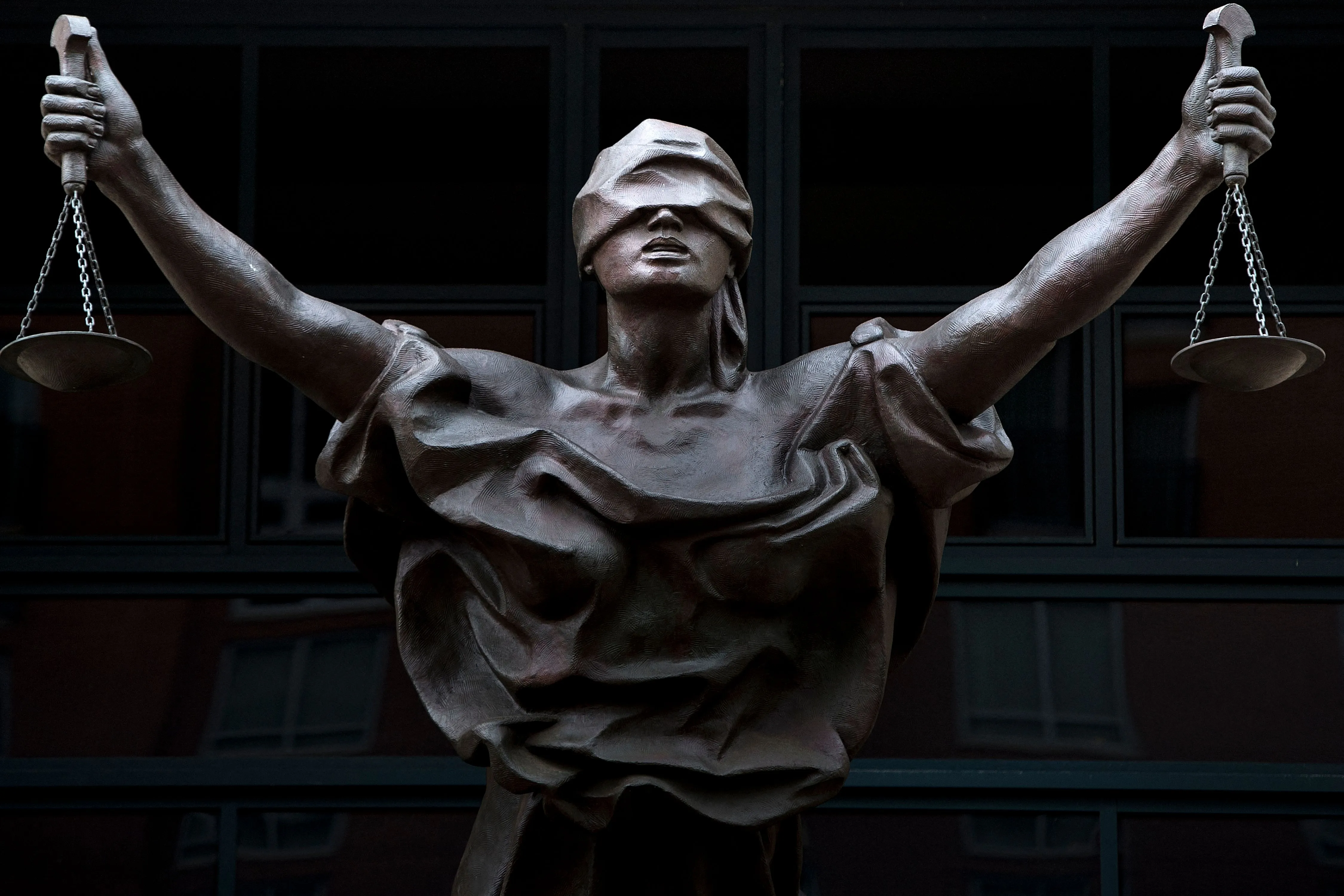 A statue of Justice outside the Albert V. Bryan US federal courthouse in Alexandria, Virginia.