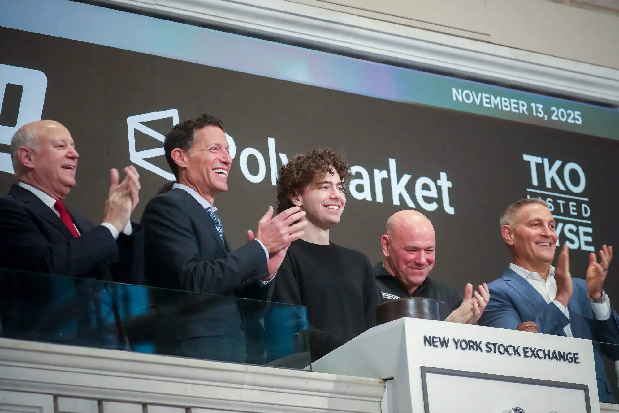 Jeff Sprecher, left, and Shayne Coplan, center left, ring the opening bell on the floor of the NYSE on Nov. 13, 2025.