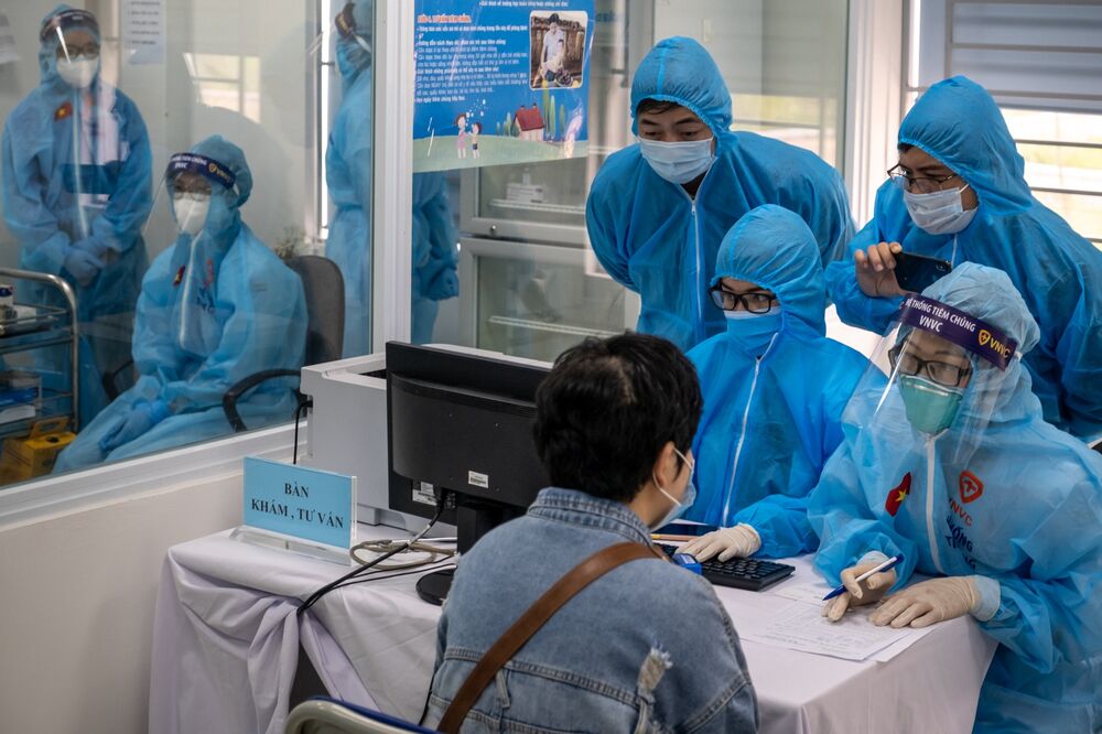 Health workers collect information prior to vaccination in Hanoi on March 8.