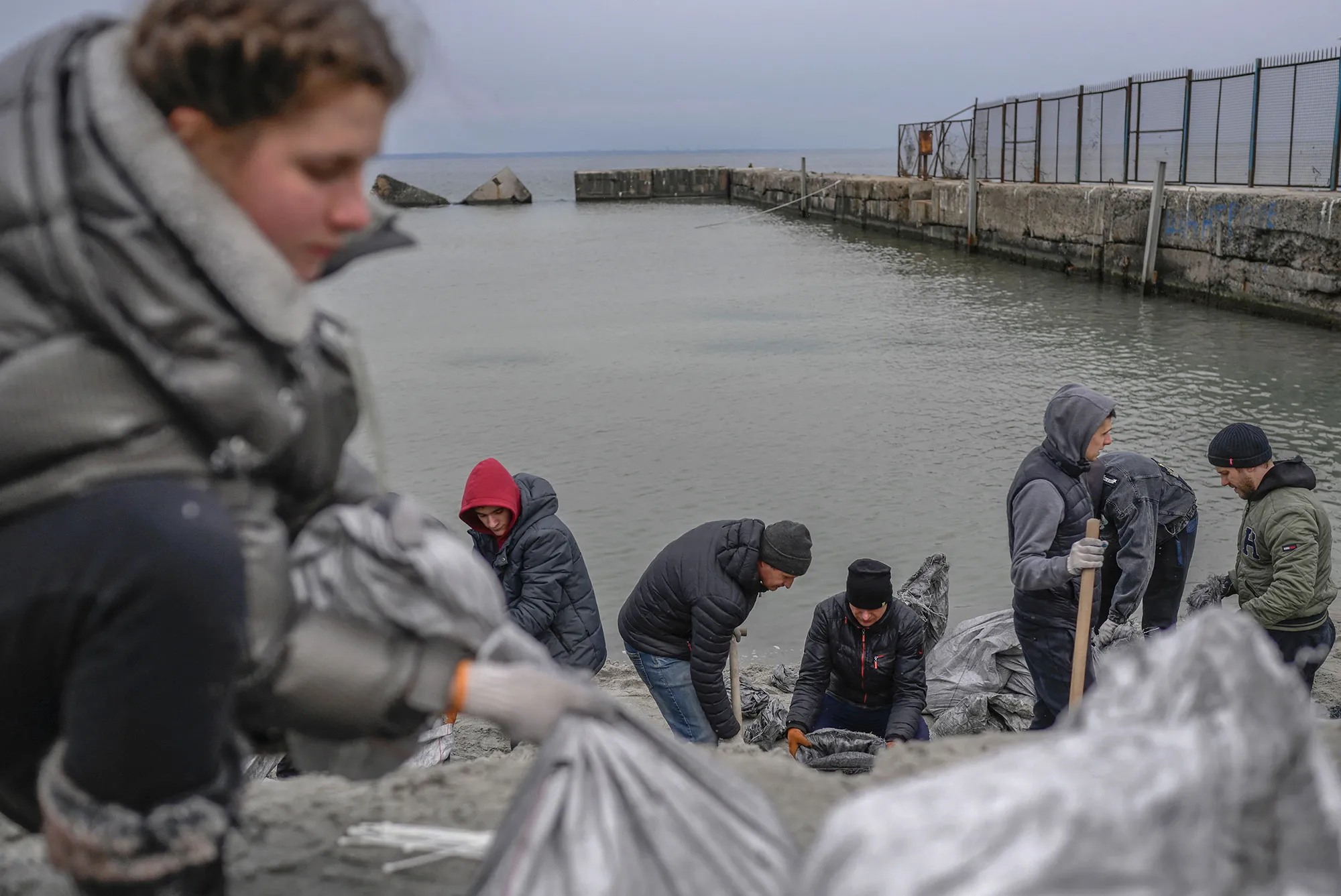 Citizens fill bags with sand for frontlines, along the beach of the Black Sea city of Odessa,&nbsp;southern Ukraine on March 7.