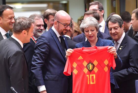 May Gets World Cup Ambush Before Brexit Pitch Battle Begins