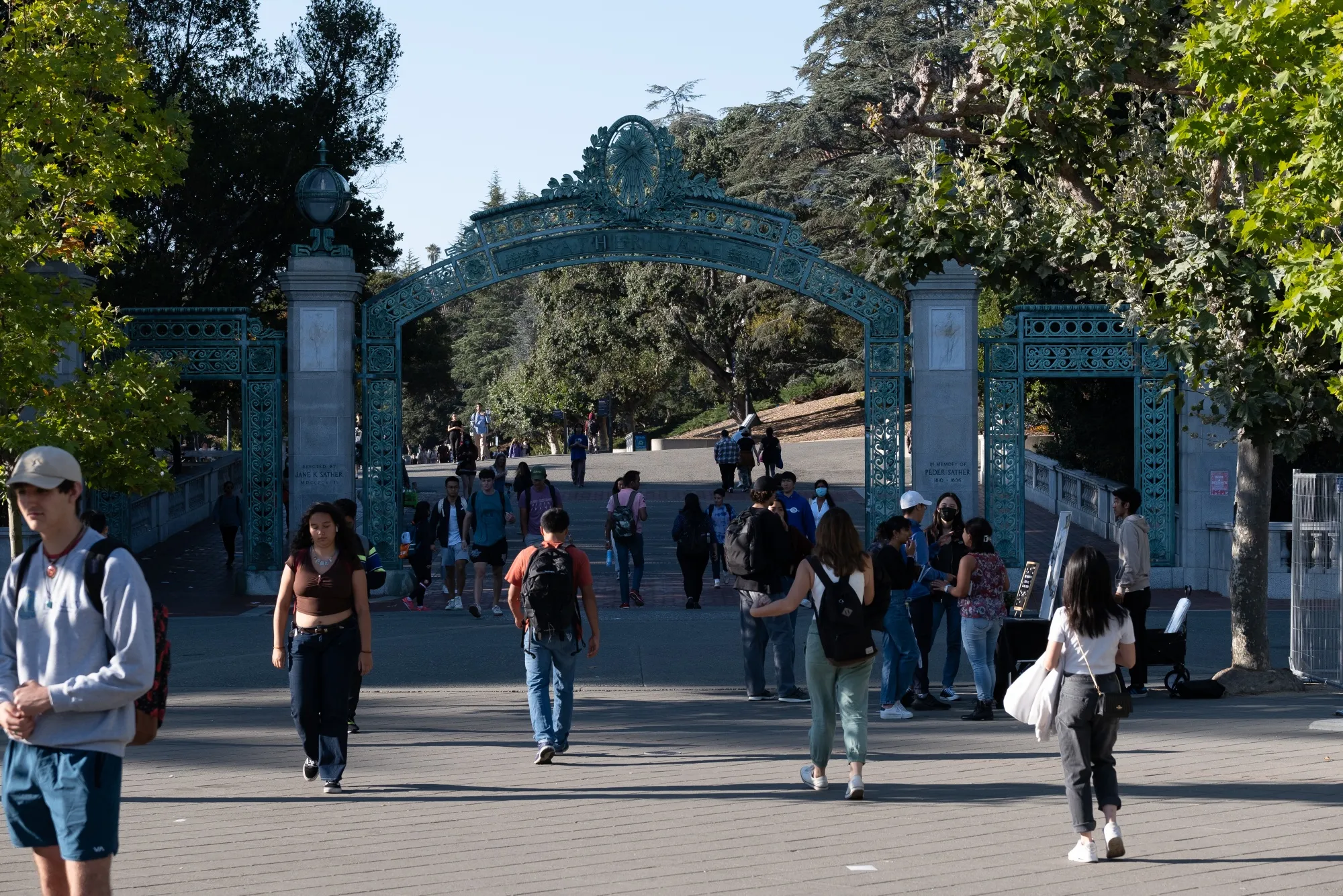 Students pass through Sather Gate on the University of California, Berkeley campus in Berkeley, California.