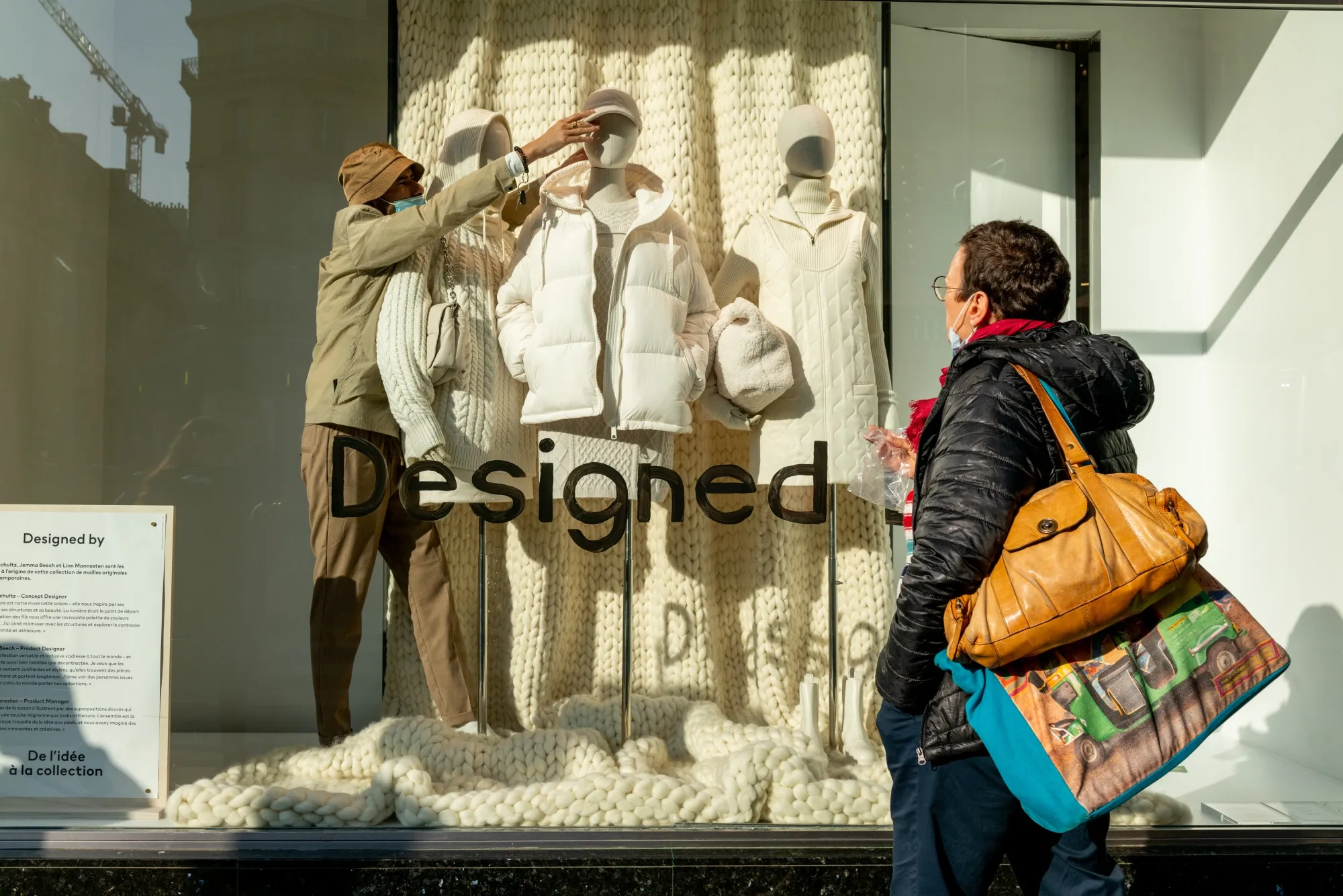 A pedestrian looks at a window display in a fashion store in Paris, France, on Nov. 10, 2021.&nbsp;