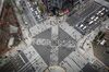Pedestrians cross an intersection in the Ginza area in Tokyo, Japan, on Saturday, Feb. 15, 2020. Japan's economy likely suffered its biggest contraction since 2014 at the end of last year leaving it in a vulnerable state, as fallout from China's viral outbreak threatens to turn a one-quarter-slump into a recession.